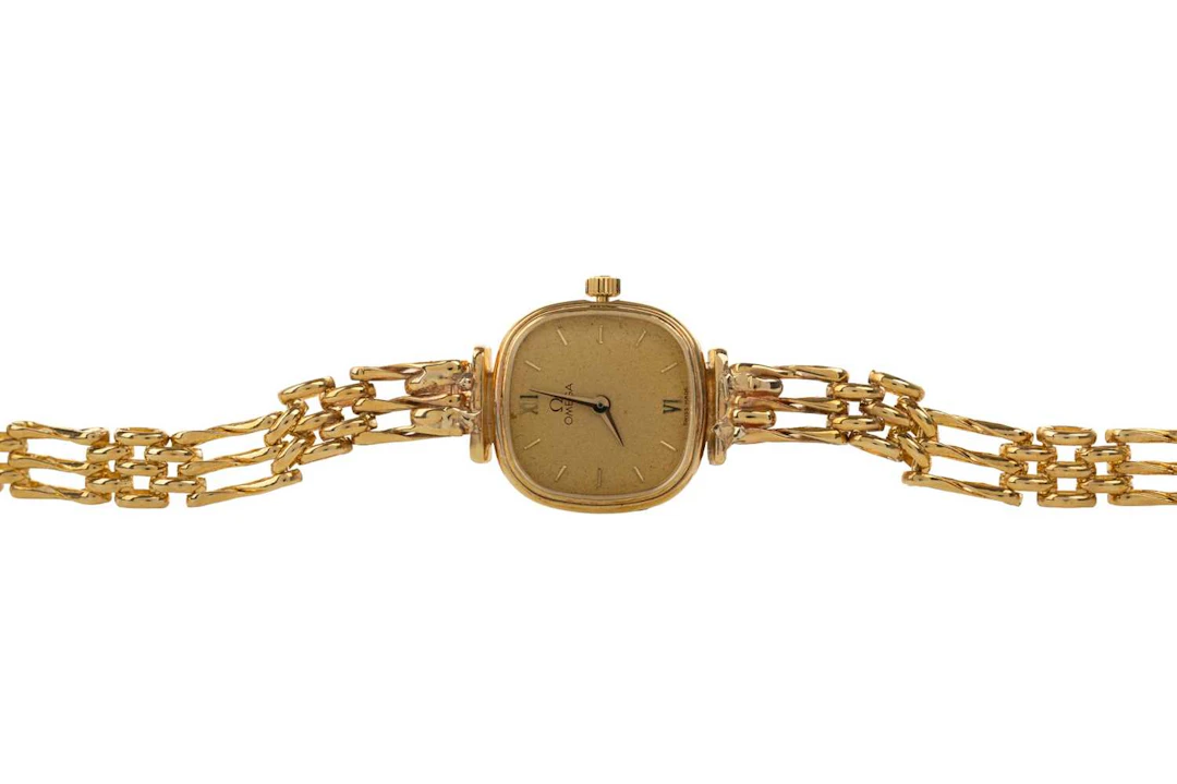 OMEGA NINE CARAT GOLD QUARTZ WRIST WATCH