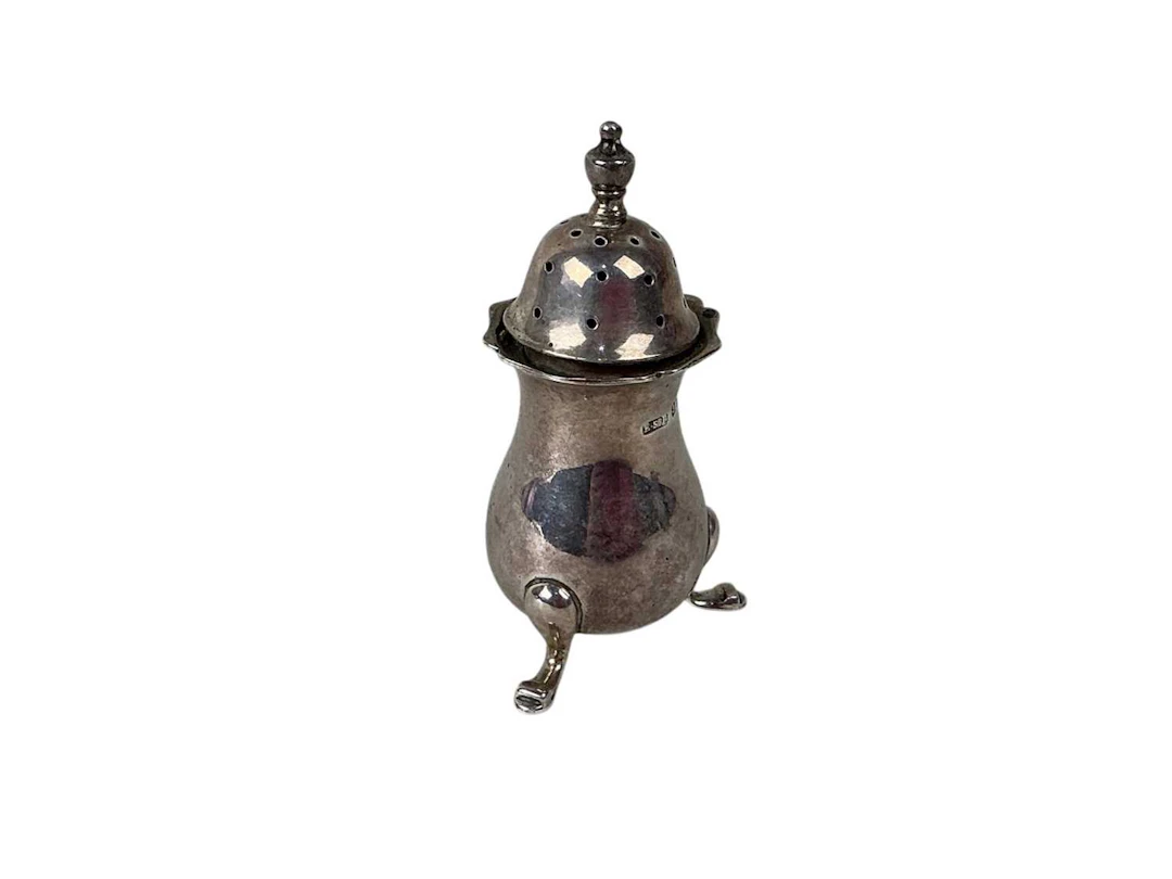 SILVER PEPPER POT, BIRMINGHAM, 1919 AND AN EGYPTIAN NAPKIN RING