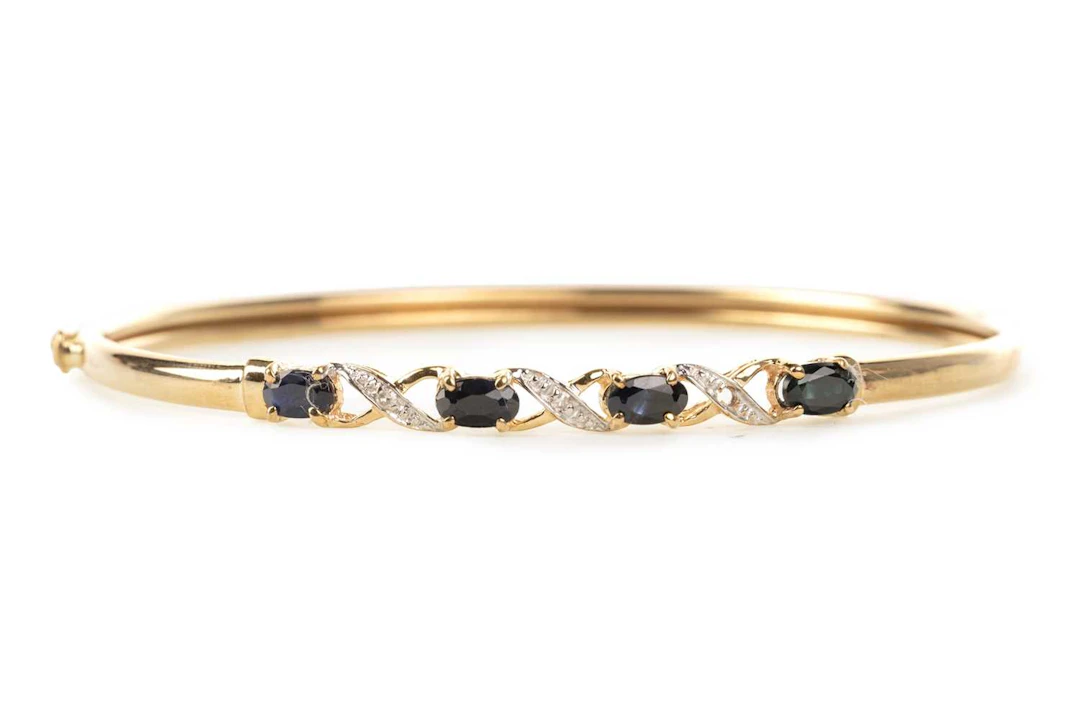 SAPPHIRE AND DIAMOND BANGLE LATE 20TH CENTURY