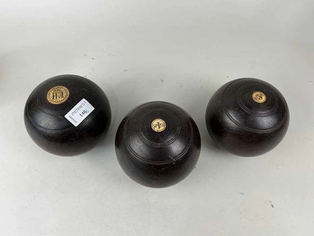 SET OF FOUR LIGNUM VITAE LAWN BOWLS EARLY 20TH CENTURY