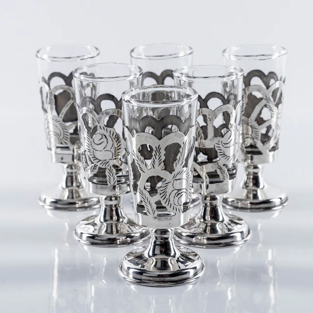 GLAS, 6 st, fot samt hölje i sterlingsilver, Mexiko, 1900-tal.