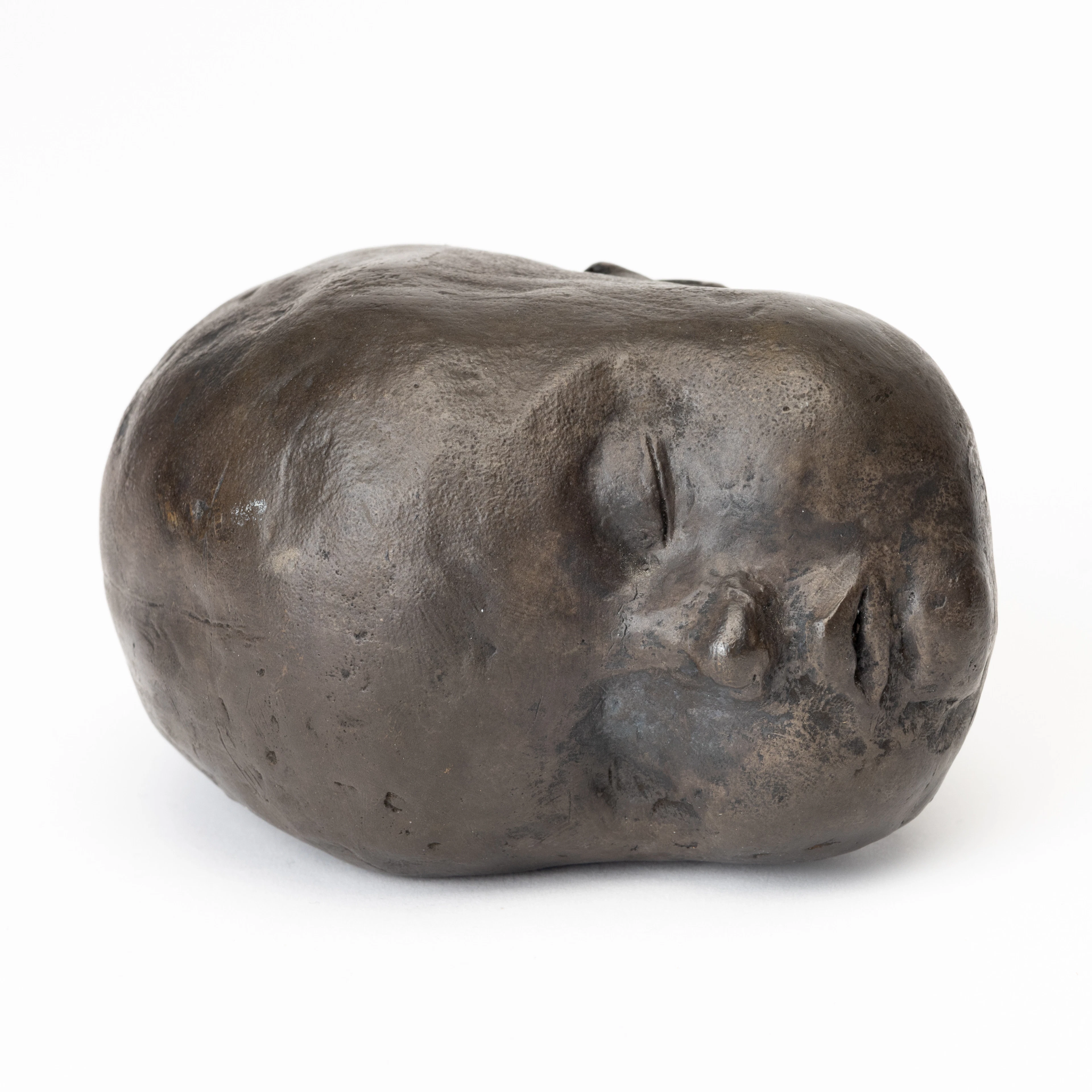 CHARLOTTE GYLLENHAMMAR. Skulptur, gråpatinerad brons, "B-head", signerad