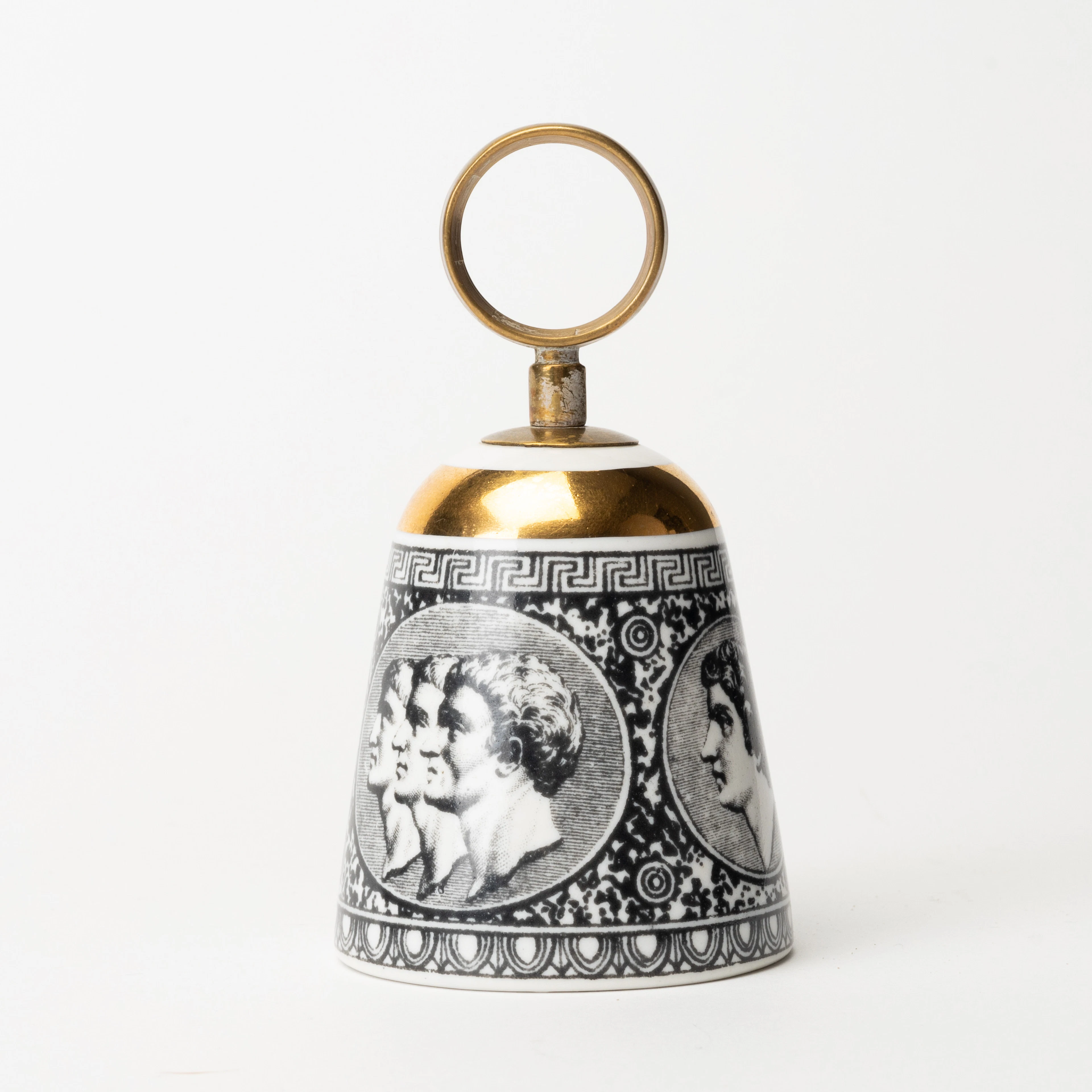 PIERO FORNASETTI. Bordsklocka, porslin, litografiskt dekorerad och