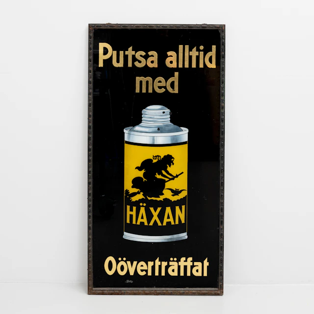 SKYLT, Häxan, litografiskt tryck på glas, 1900-talets första hälft.