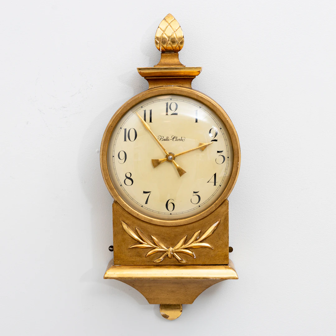 CARL MALMSTEN. Väggur, förgyllt, "Bulle-Clock, modell SM2 för Nordiska