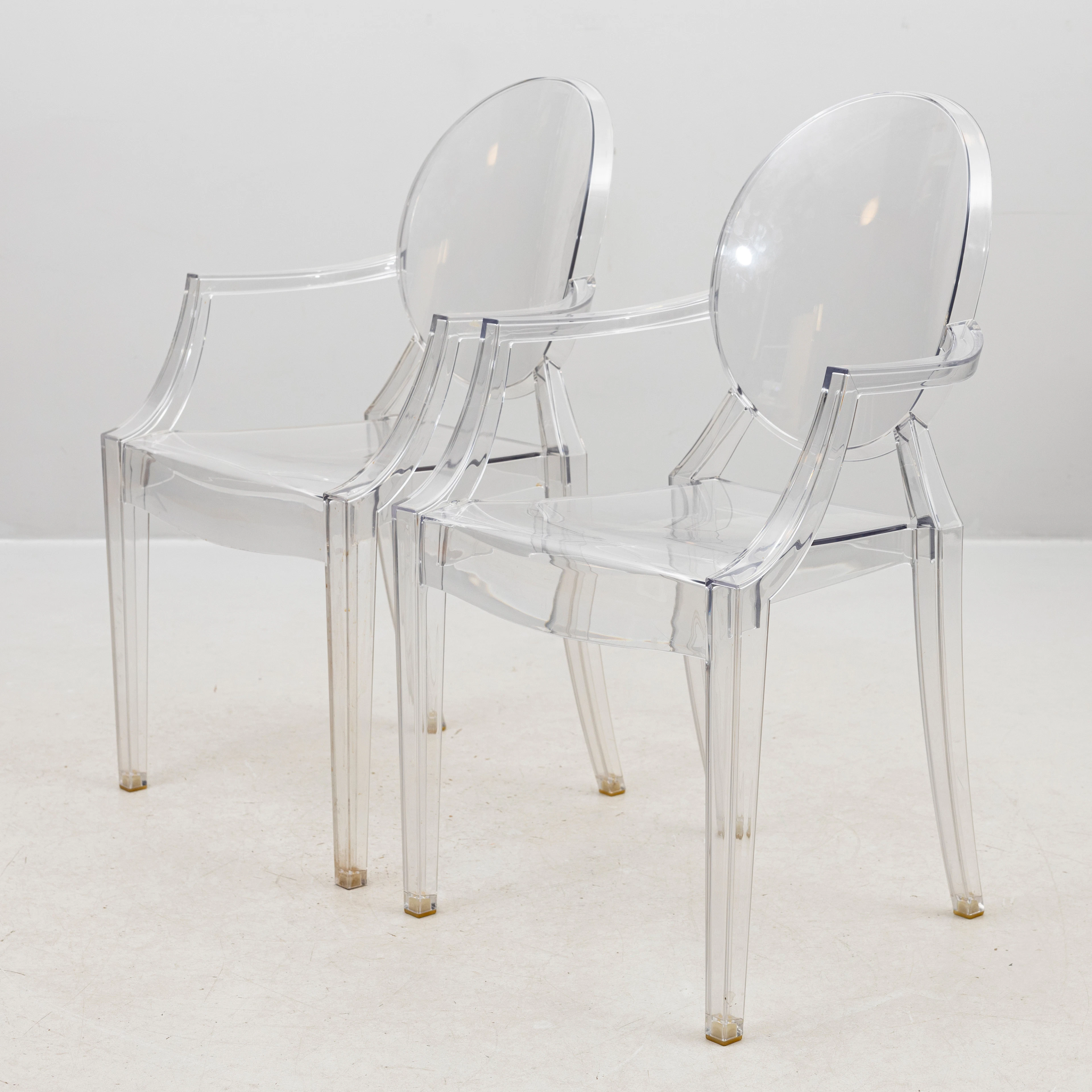 PHILIPPE STARCK. Karmstolar, ett par, transparent polykarbonat, "Louis