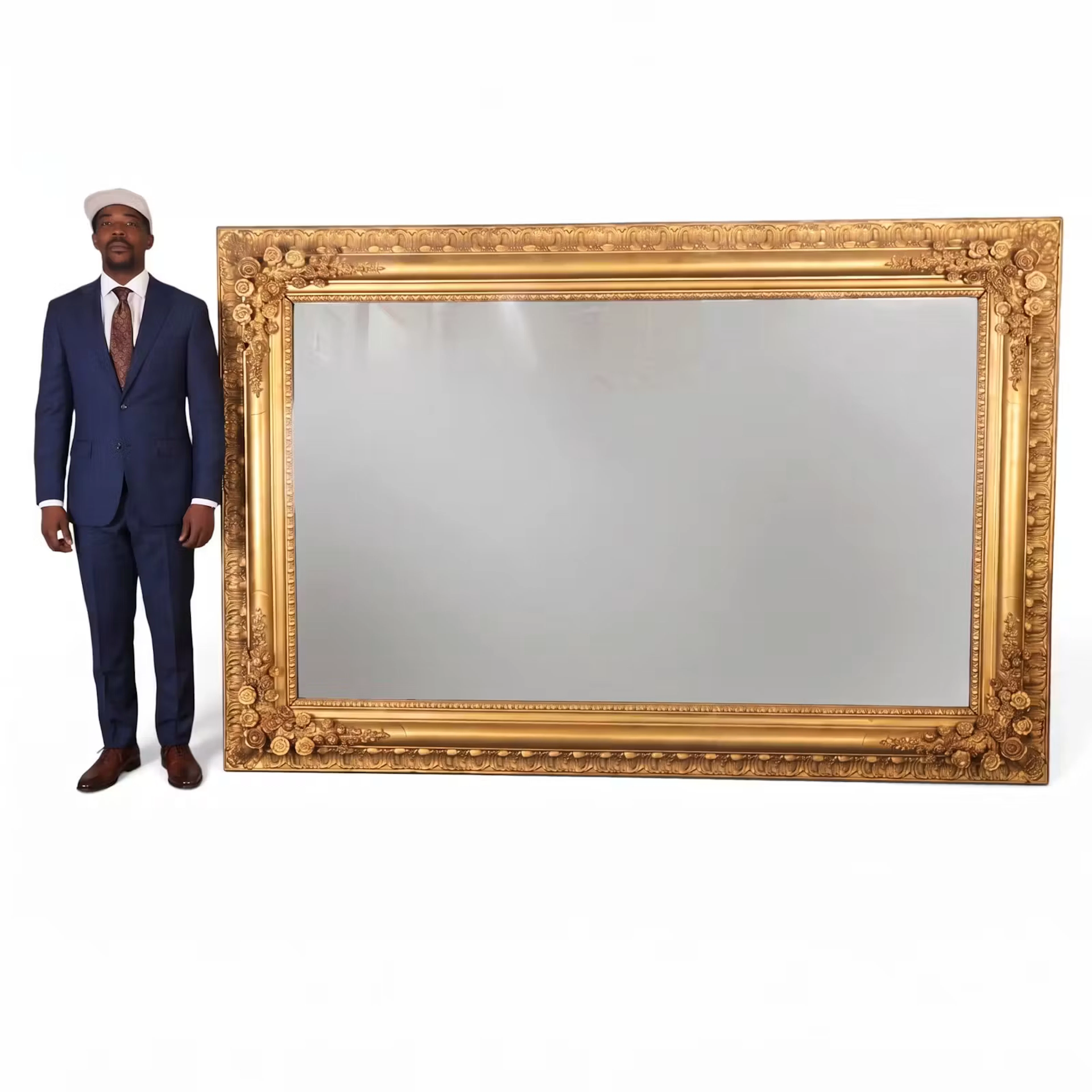 Lot 69: Monumental Gilt Mirror with Floral Corners