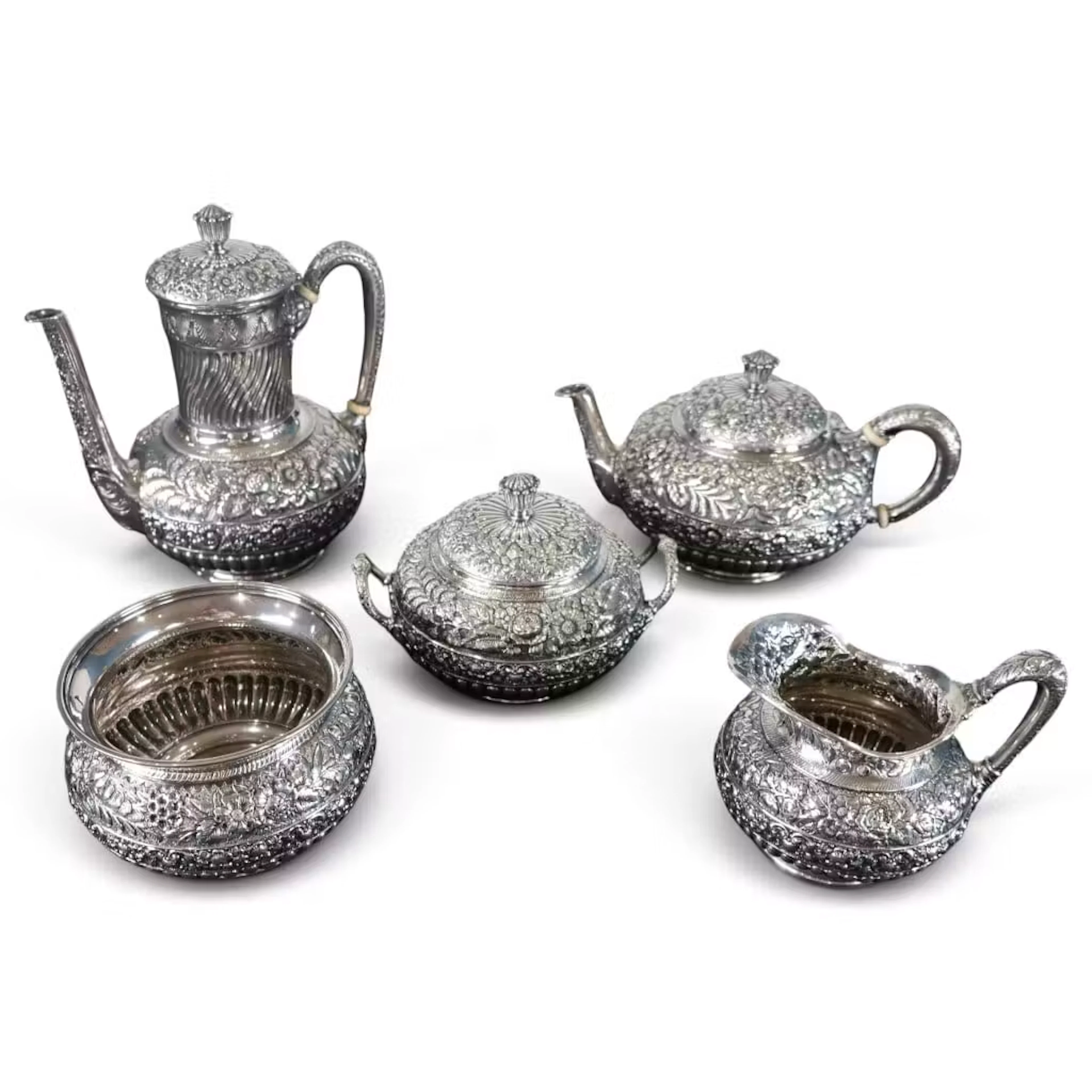Lot 55: Tiffany Five-Piece Repousse Sterling Service