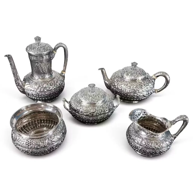 Lot 55: Tiffany Five-Piece Repousse Sterling Service