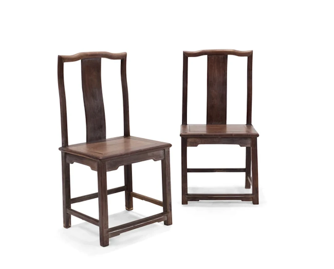 A pair of Chinese hardwood yoke back chairs 20th century Each with square backs