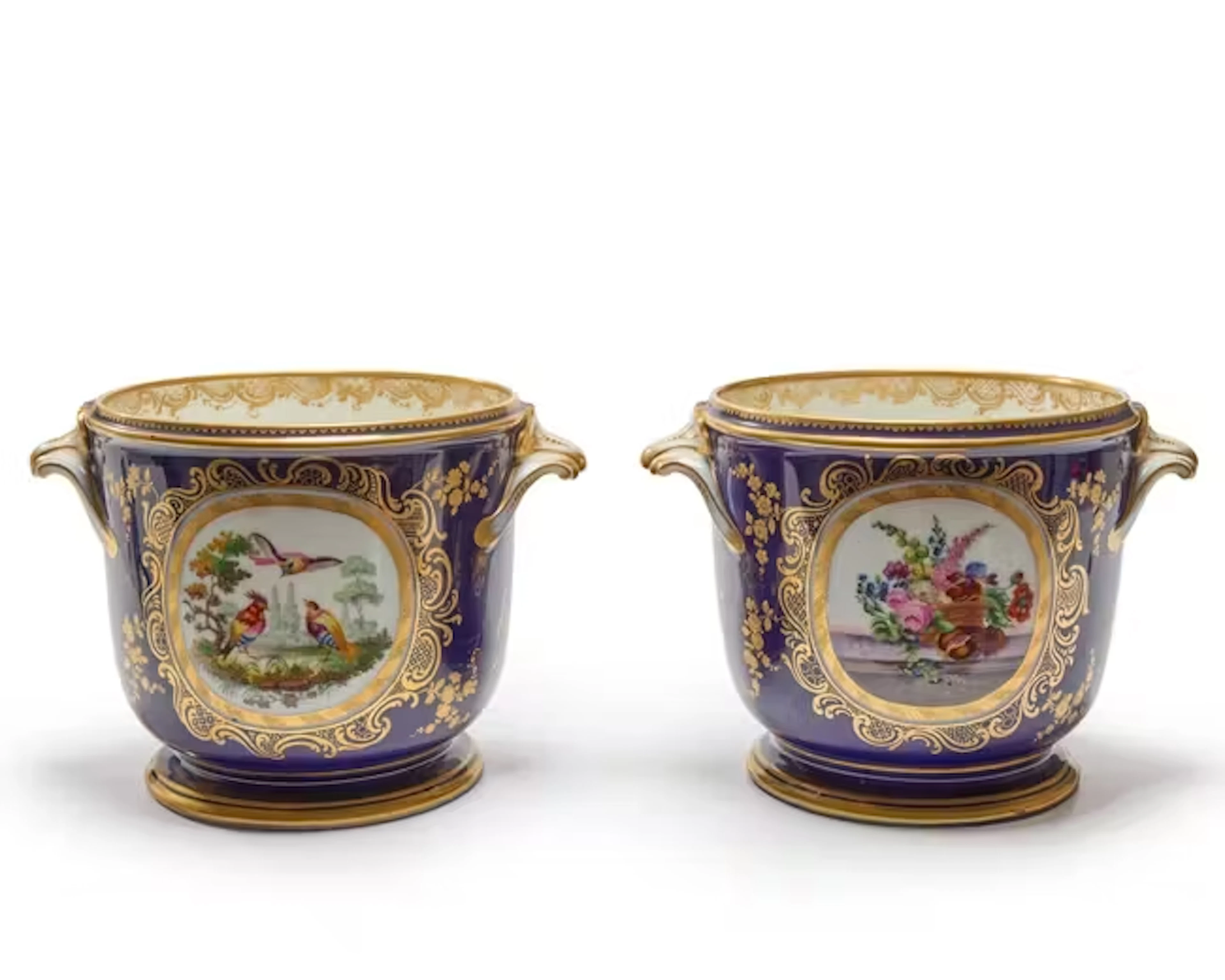 A pair of Sèvres-style porcelain bleu de Roi ground...