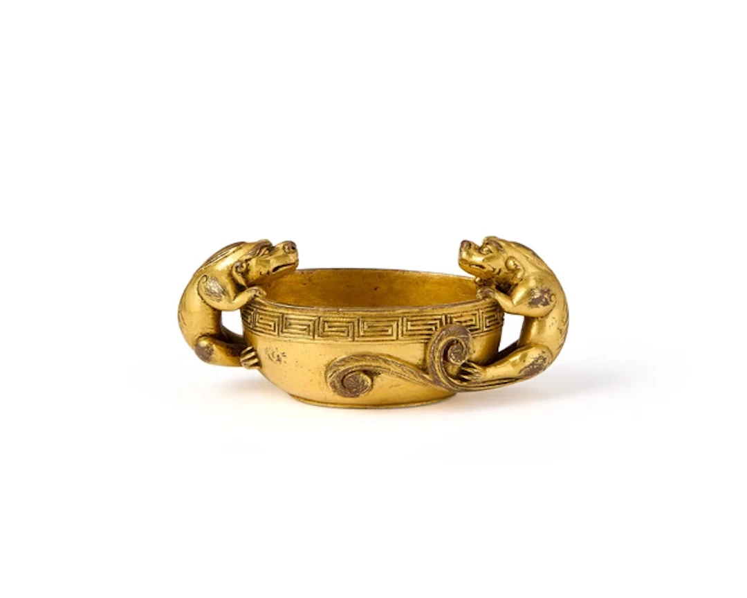 A Chinese gilt bronze twin-handled cup Ming dynasty Of oval form