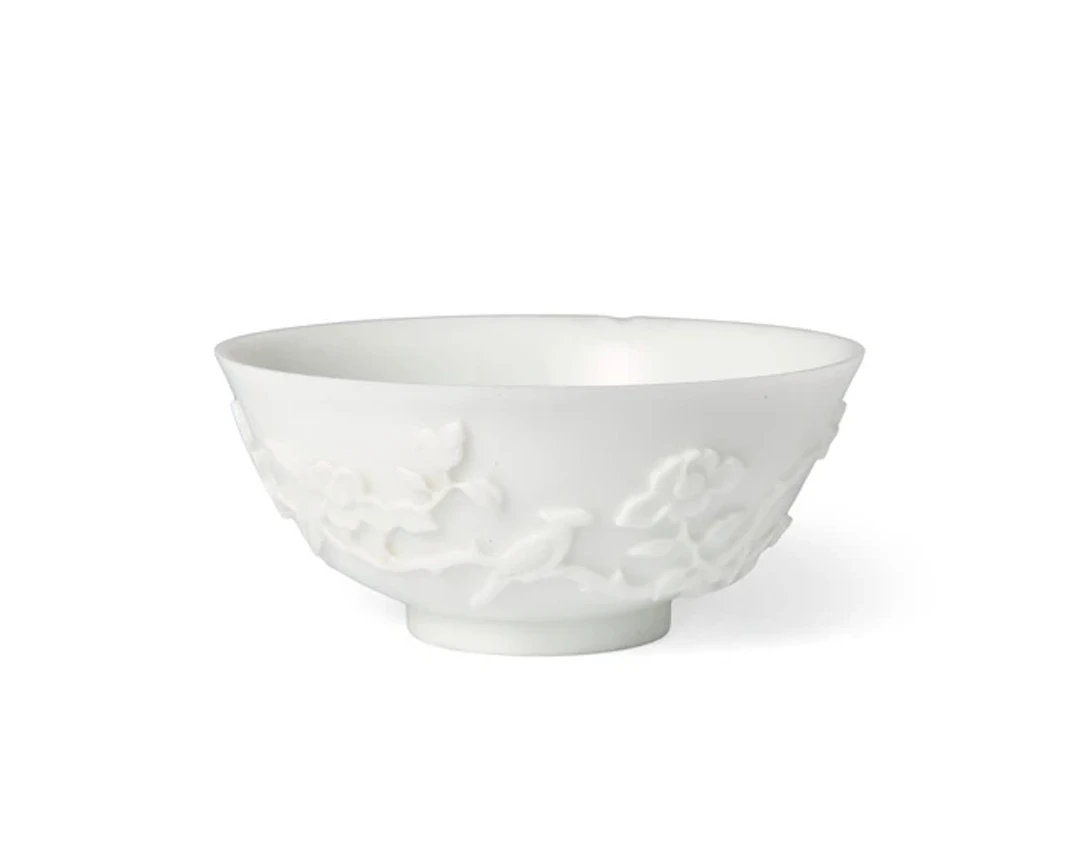 A Chinese carved white Peking glass bowl Qing dynasty
