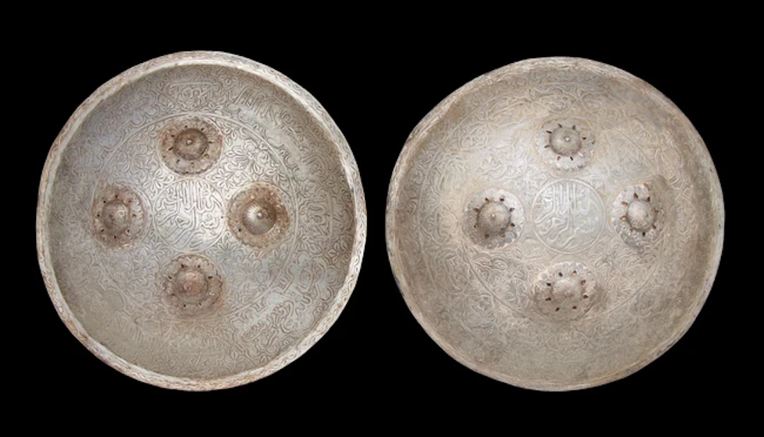 Two acid etched calligraphic circular shields