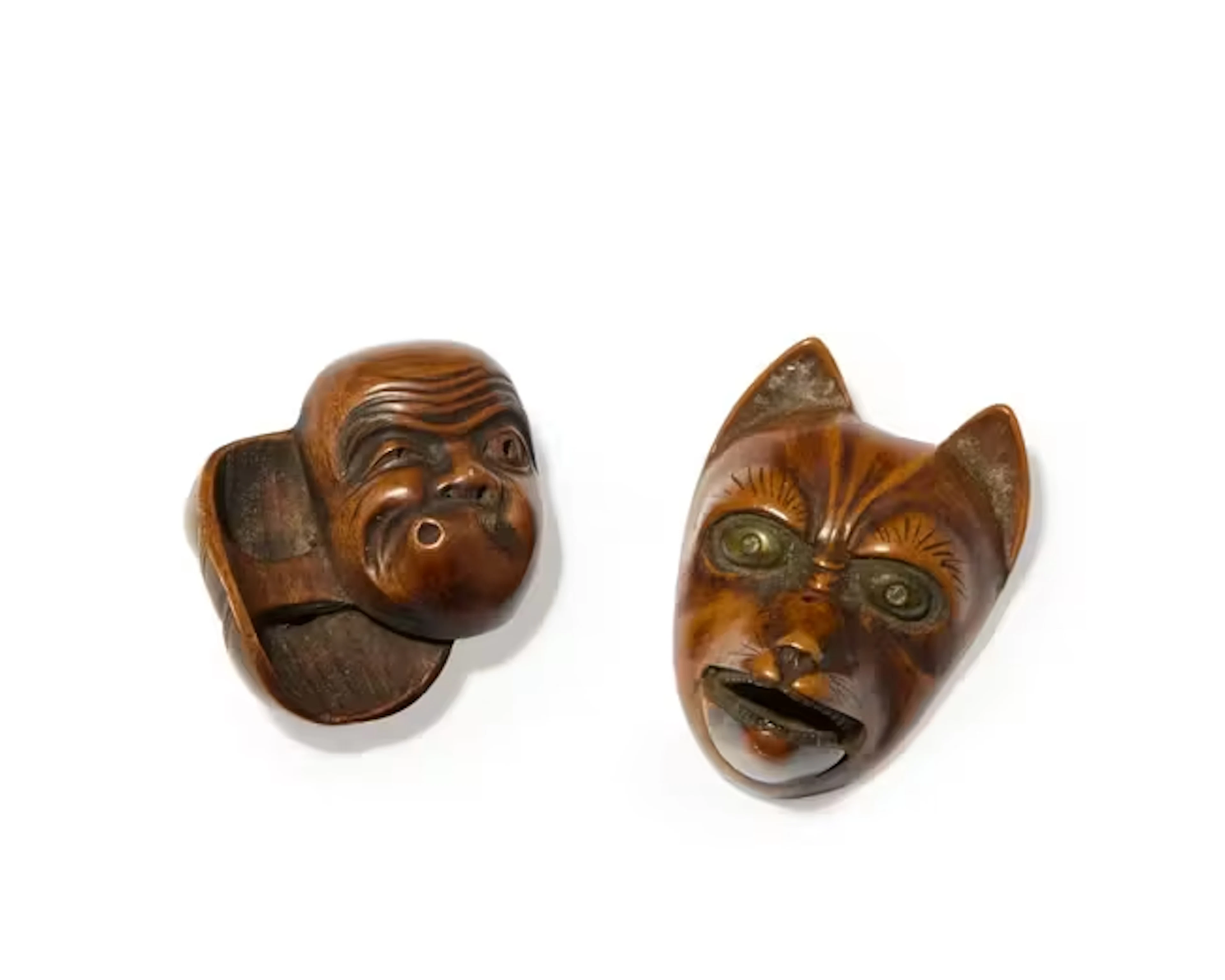 Two Japanese wood carved netsuke Edo period One in form...