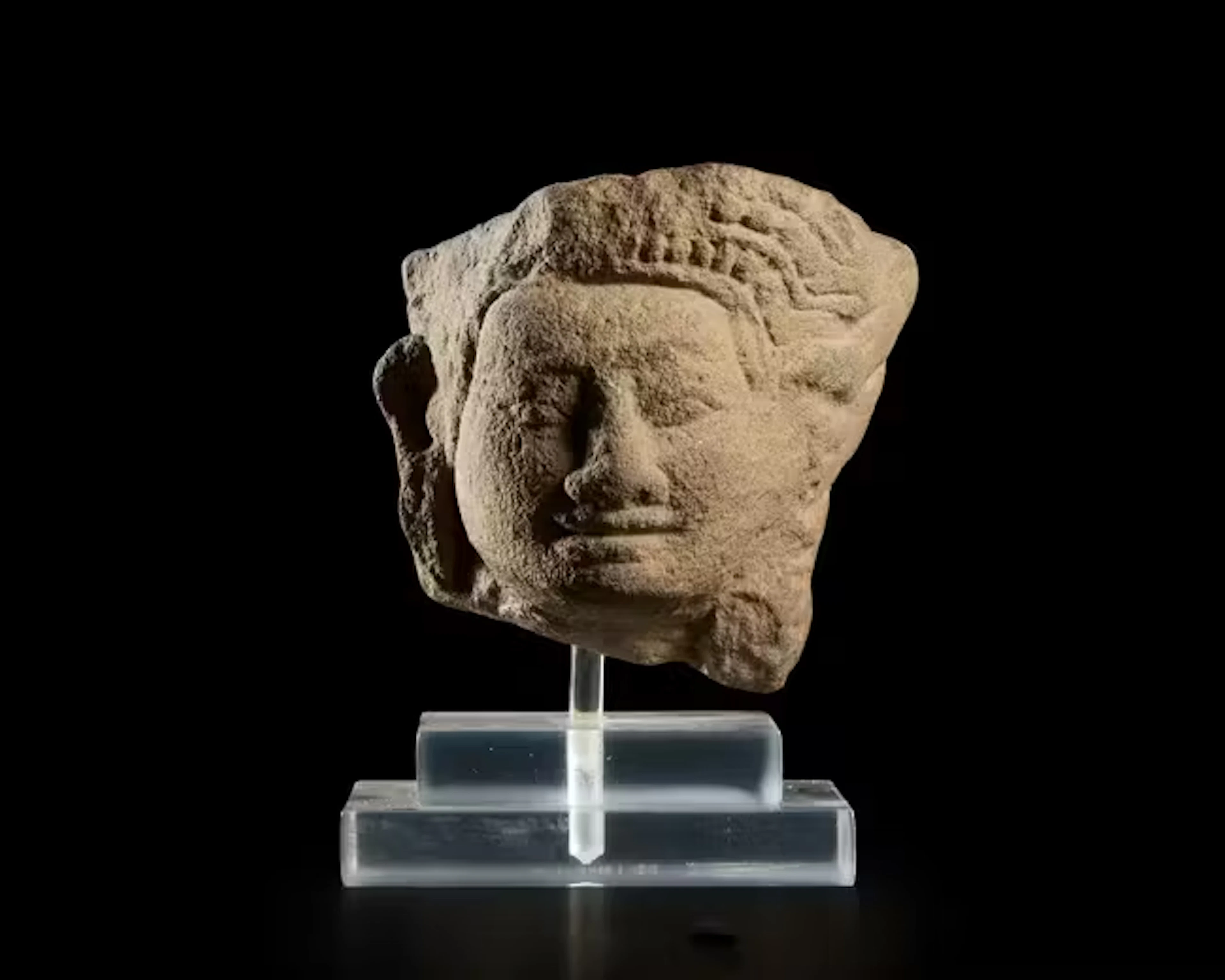 A carved stone fragmentary head