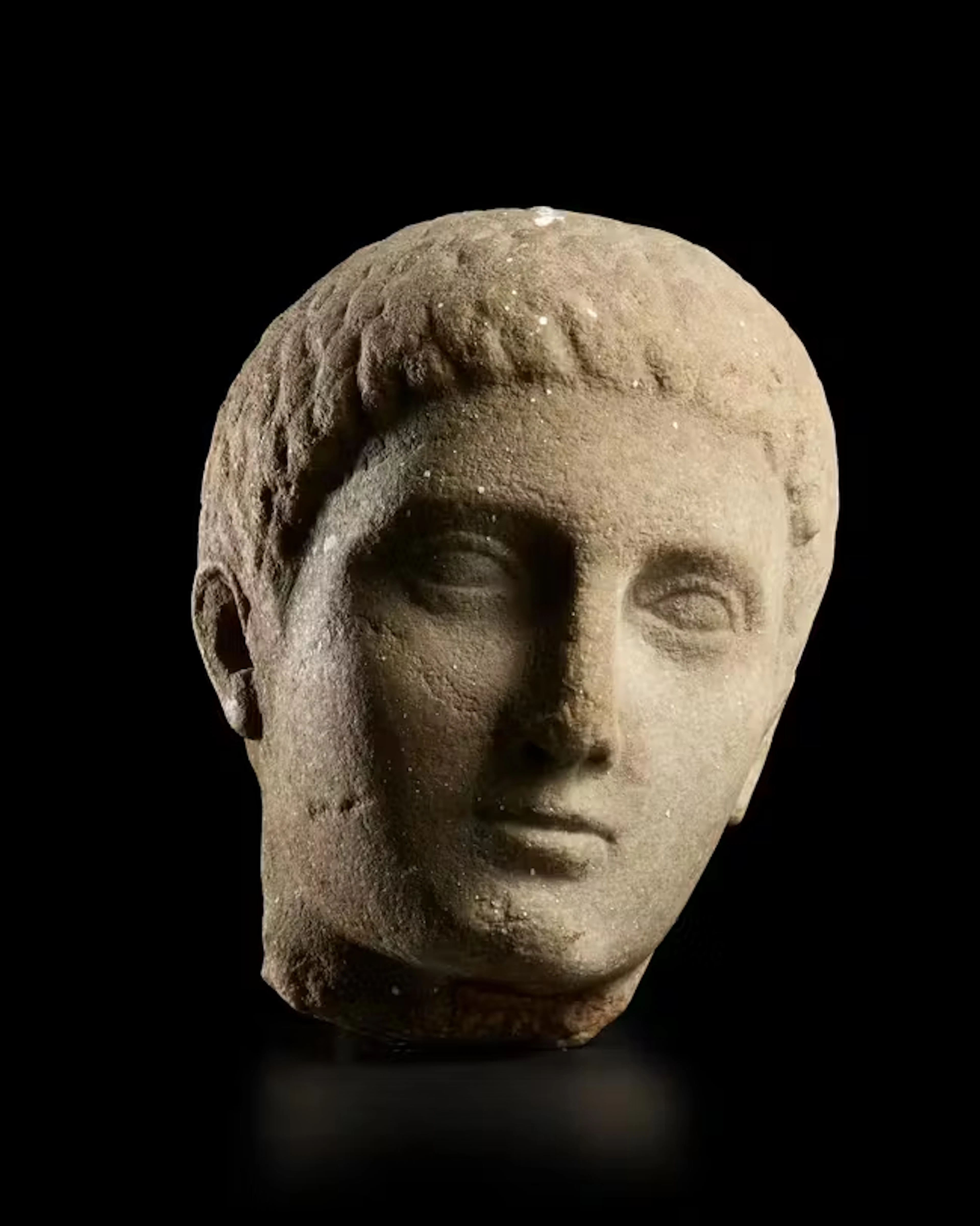 A Roman carved marble head of a youth