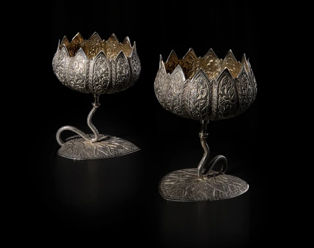 Two engraved and repousse silver cups