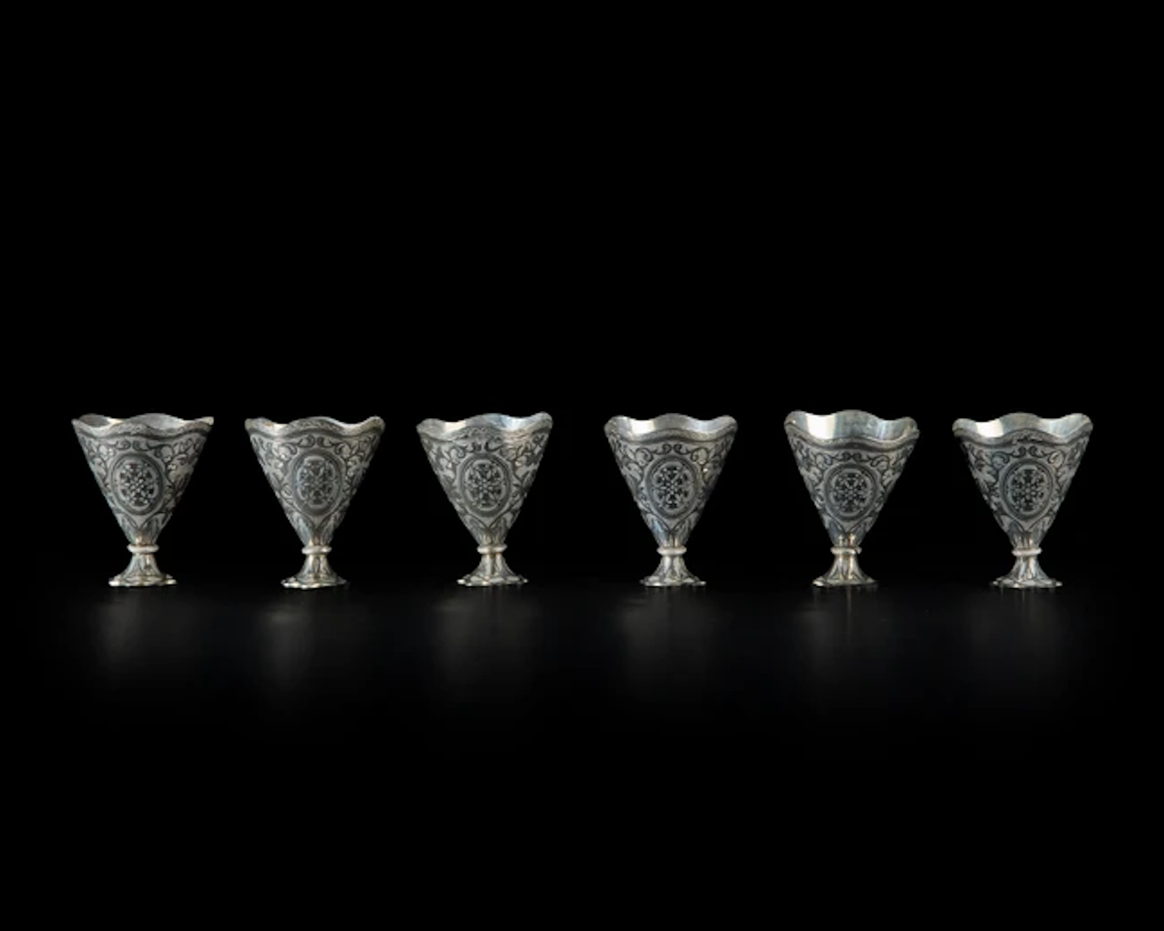 Six nielloed white metal cup holders (zarfs)