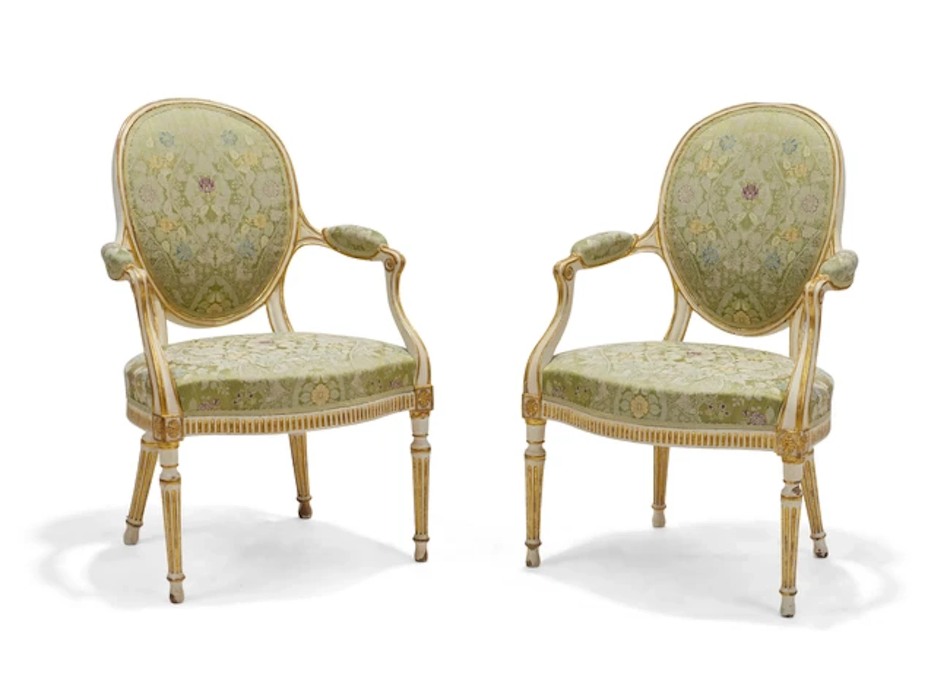 A pair of George III parcel-gilt and cream-painted armchairs