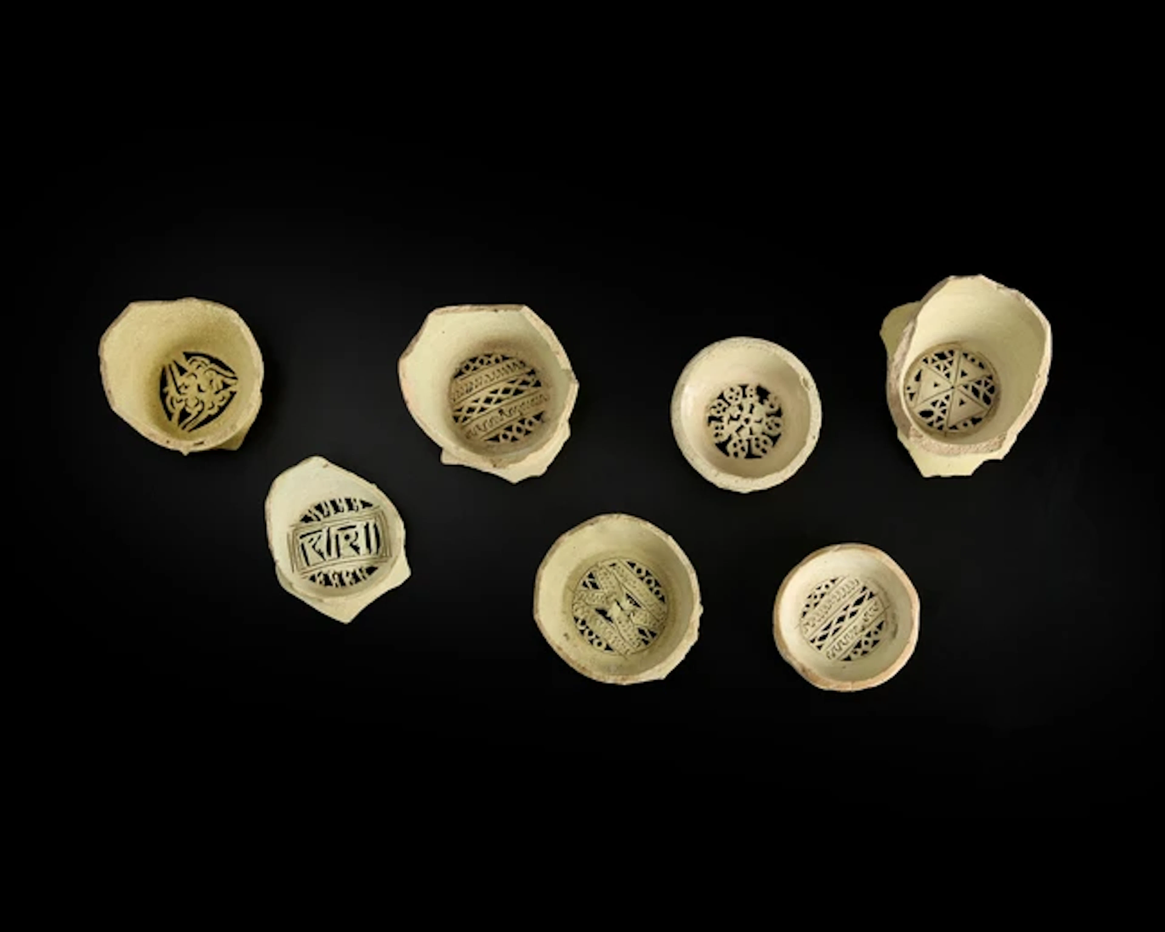 Seven fragmentary unglazed pottery water filters