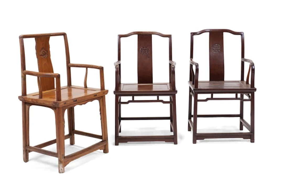 Three Chinese chairs 20th century Comprising: a pair of square member arm chairs
