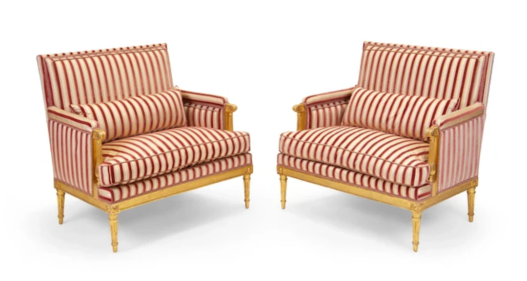 A pair of Louis XVI carved giltwood marquises