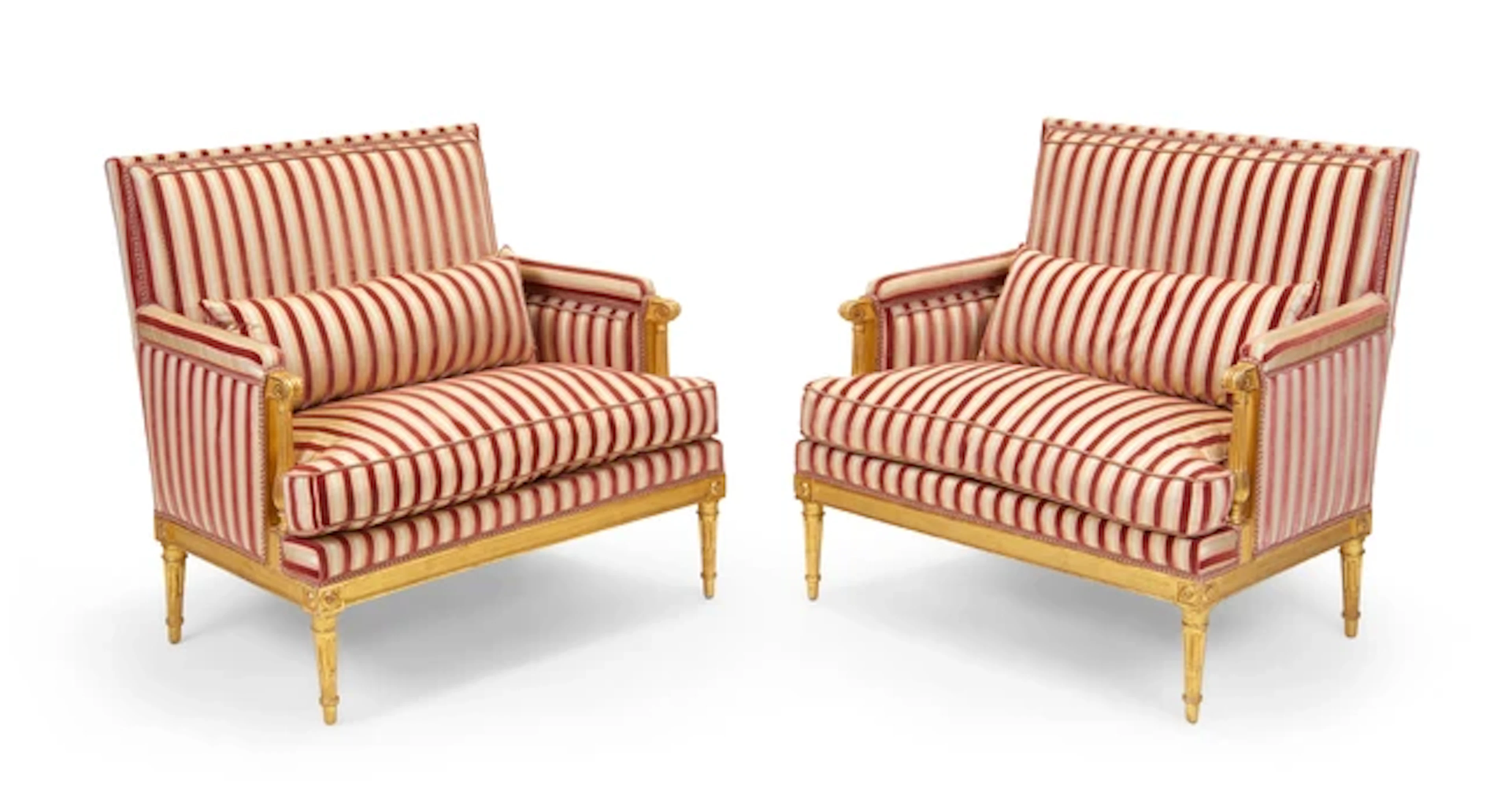 A pair of Louis XVI carved giltwood marquises