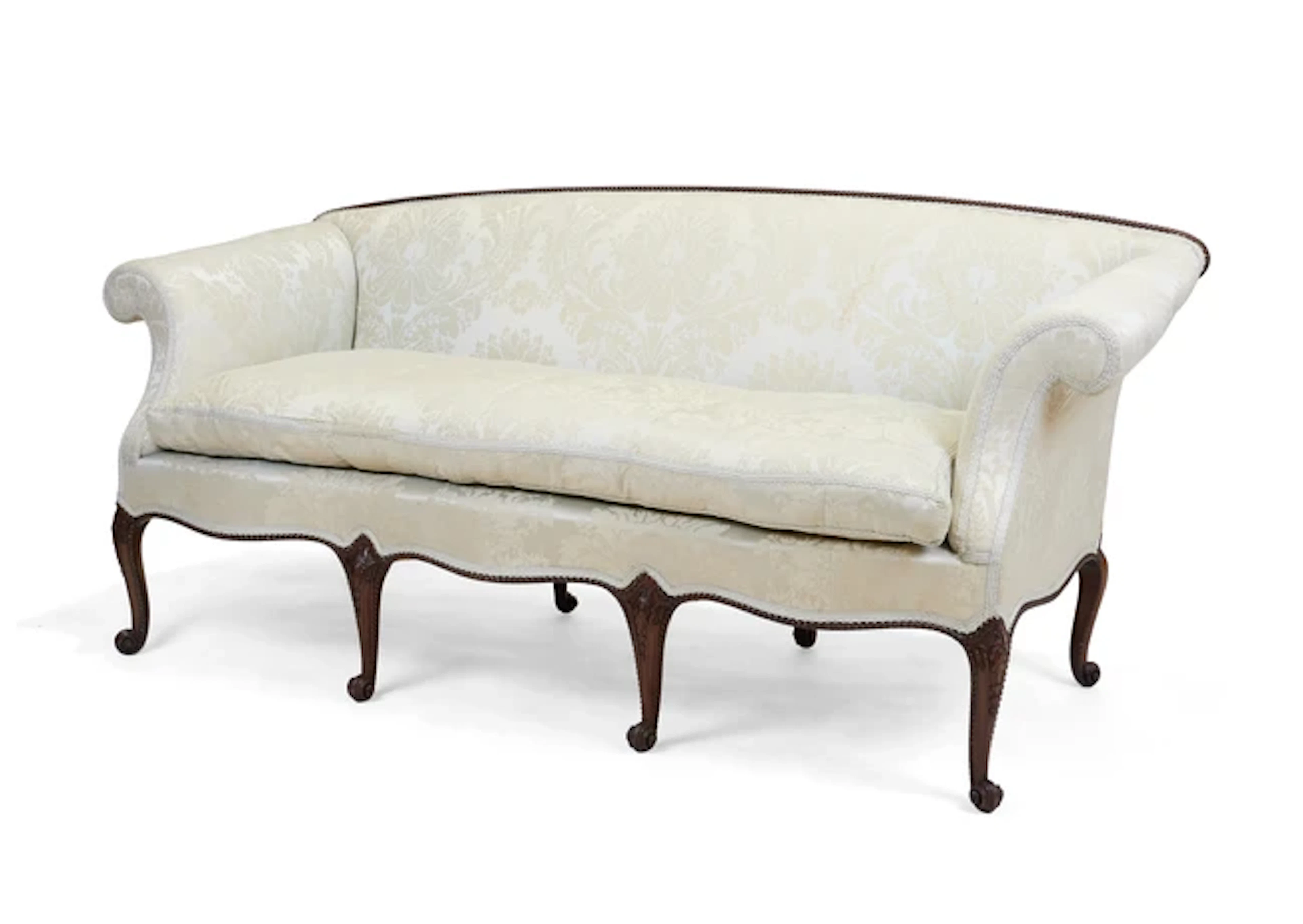 An Edwardian mahogany serpentine front sofa