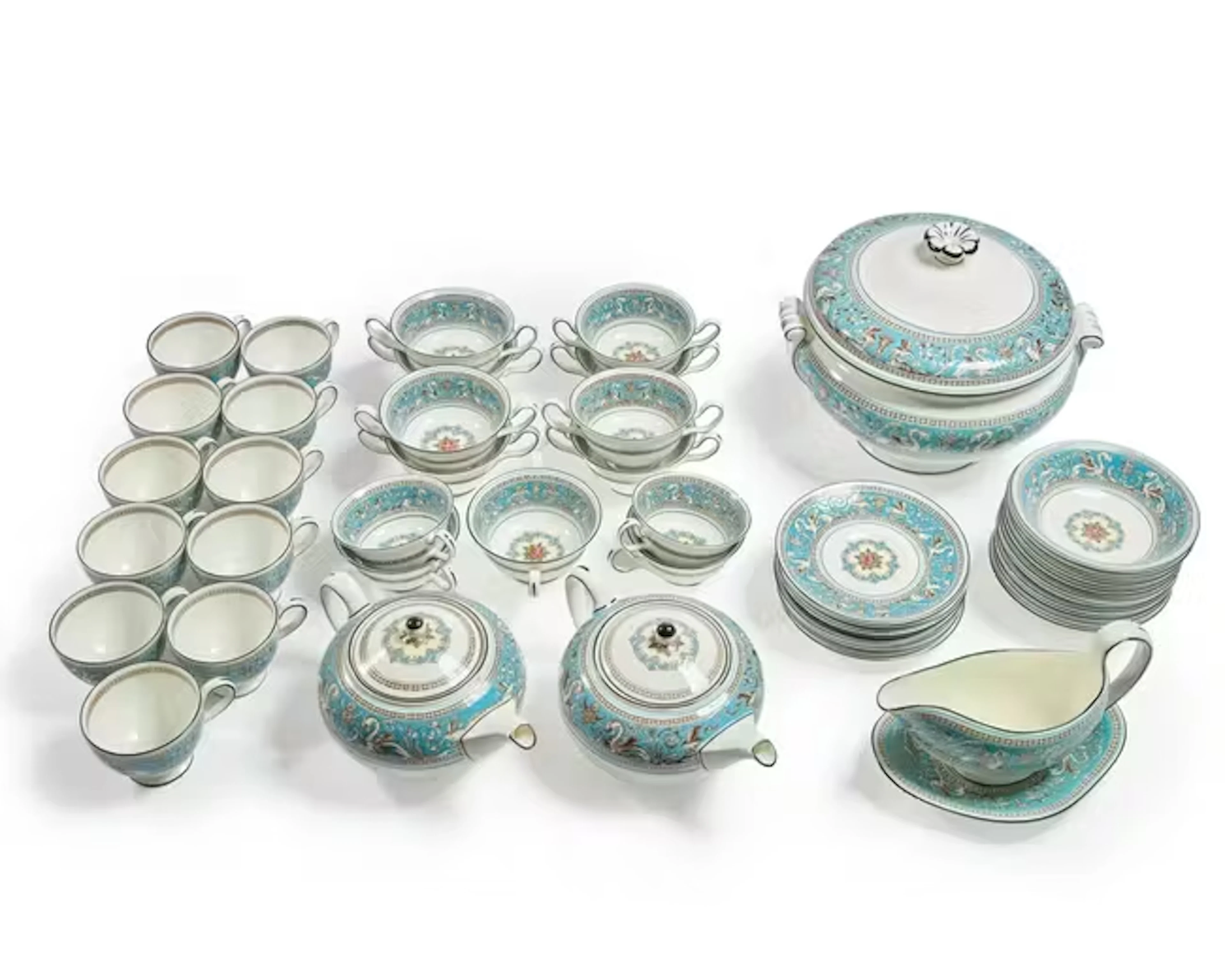 An extensive Wedgwood porcelain 'Florentine' pattern part dinner service