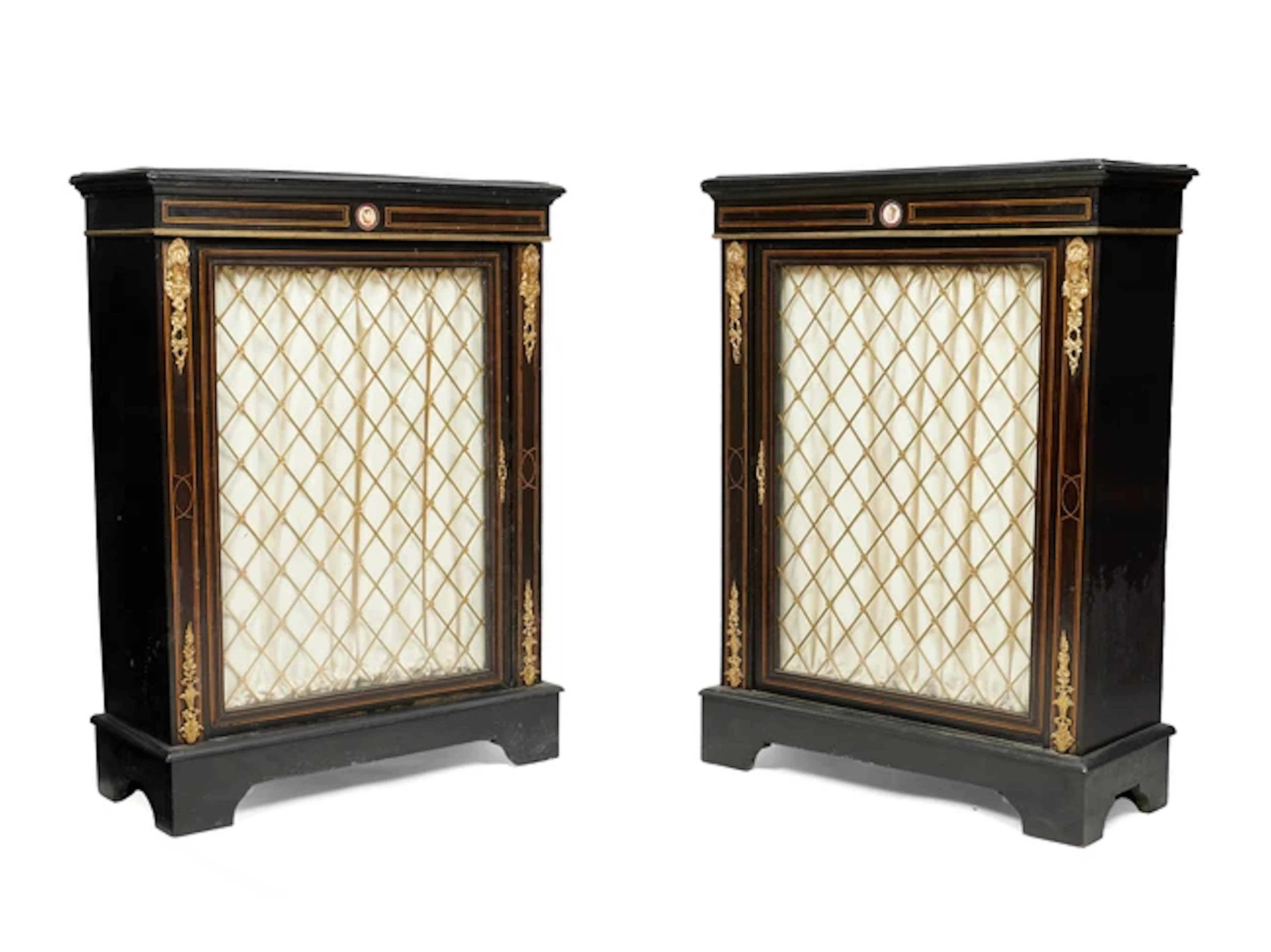 A pair of Victorian gilt-metal mounted boxwood strung ebonised pier cabinets