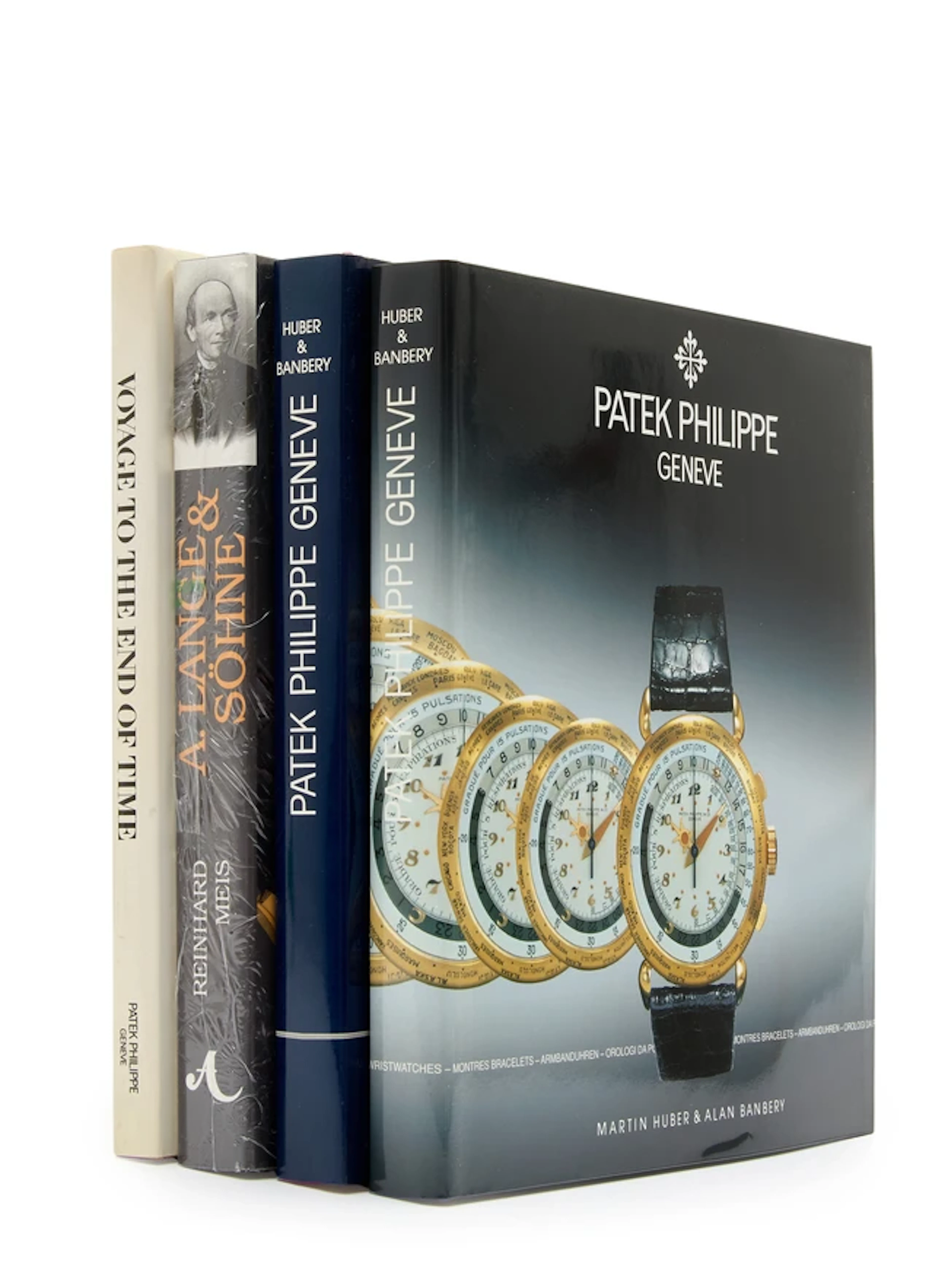 A group of 4 watch books