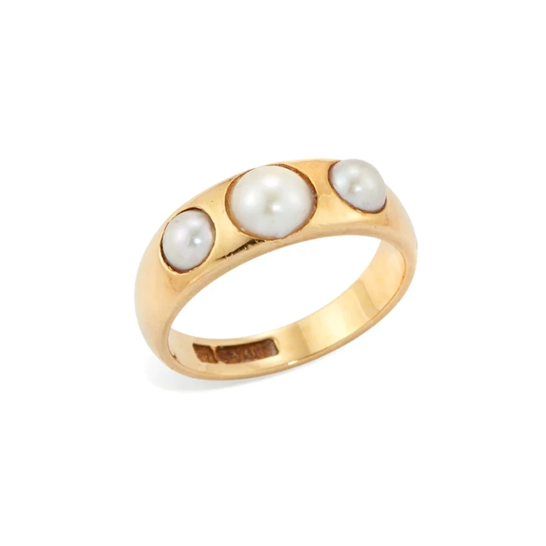 An early 20th century 18ct gold half-pearl ring