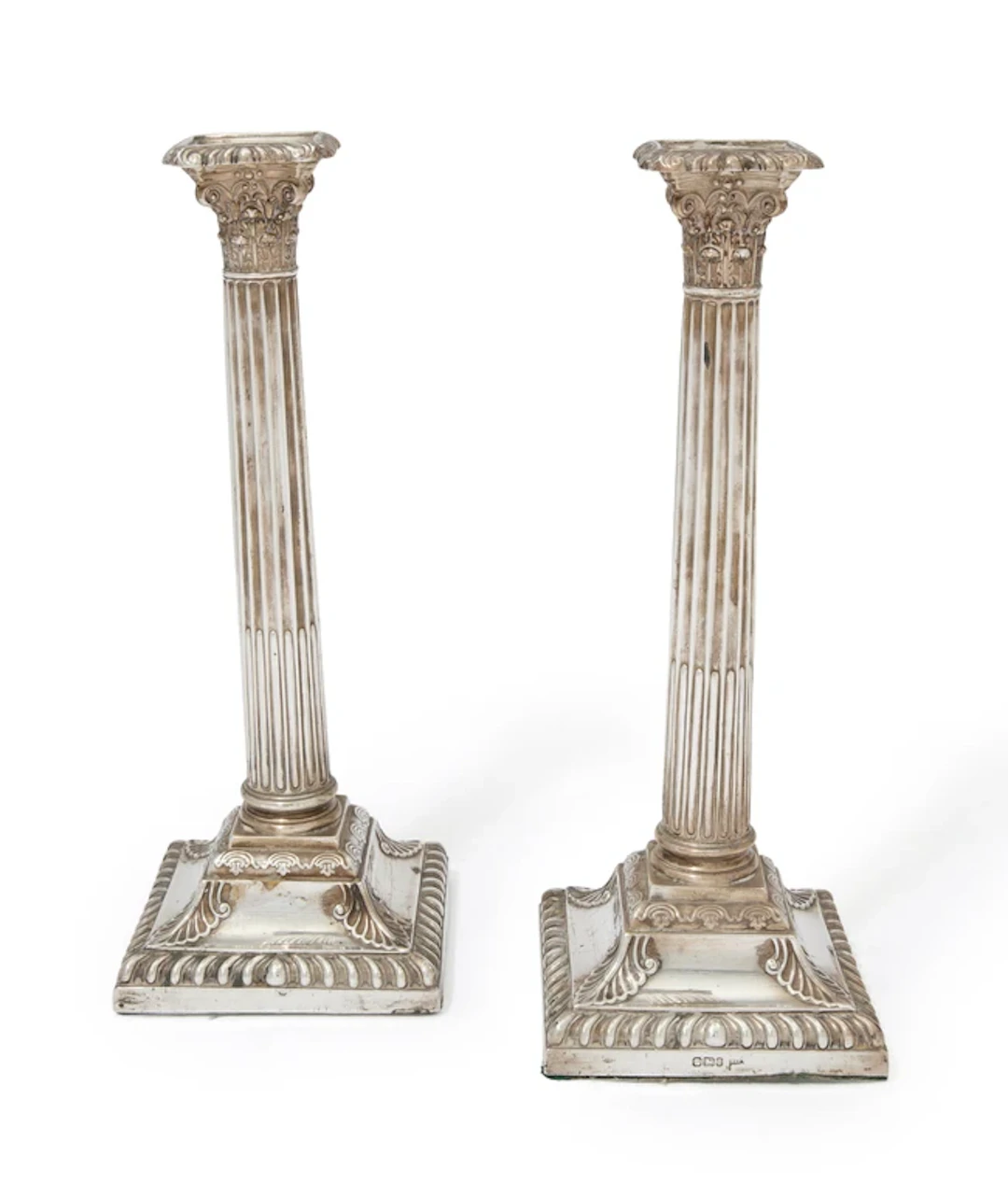 A pair of Victorian silver candlesticks