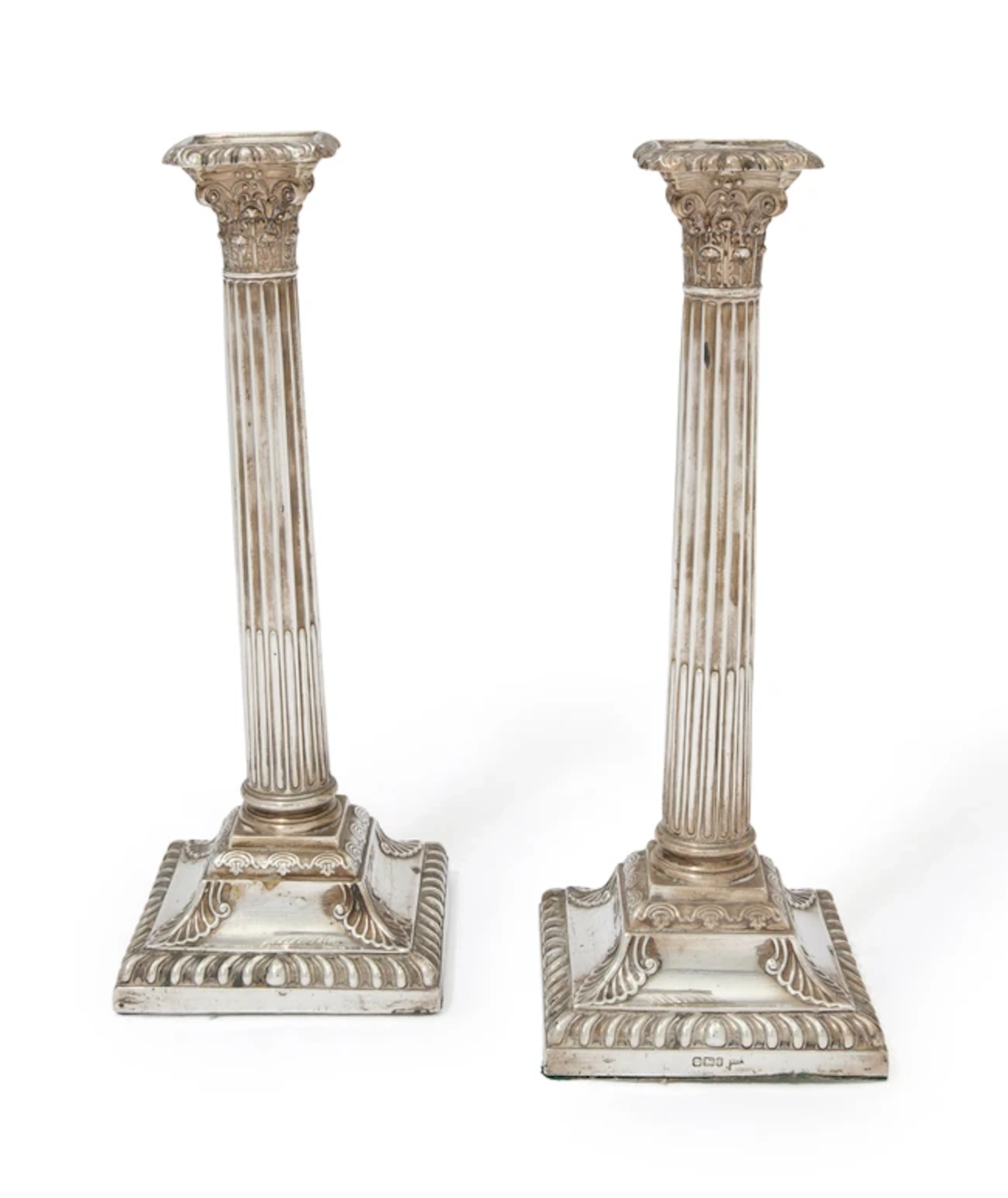 A pair of Victorian silver candlesticks