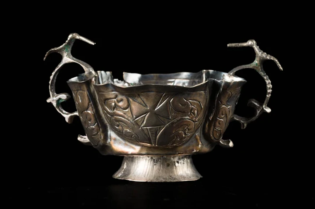 A small double-handled silver cup