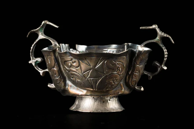 A small double-handled silver cup