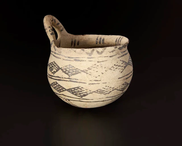 A Middle Bronze Age white painted ware deep-bowled dipper