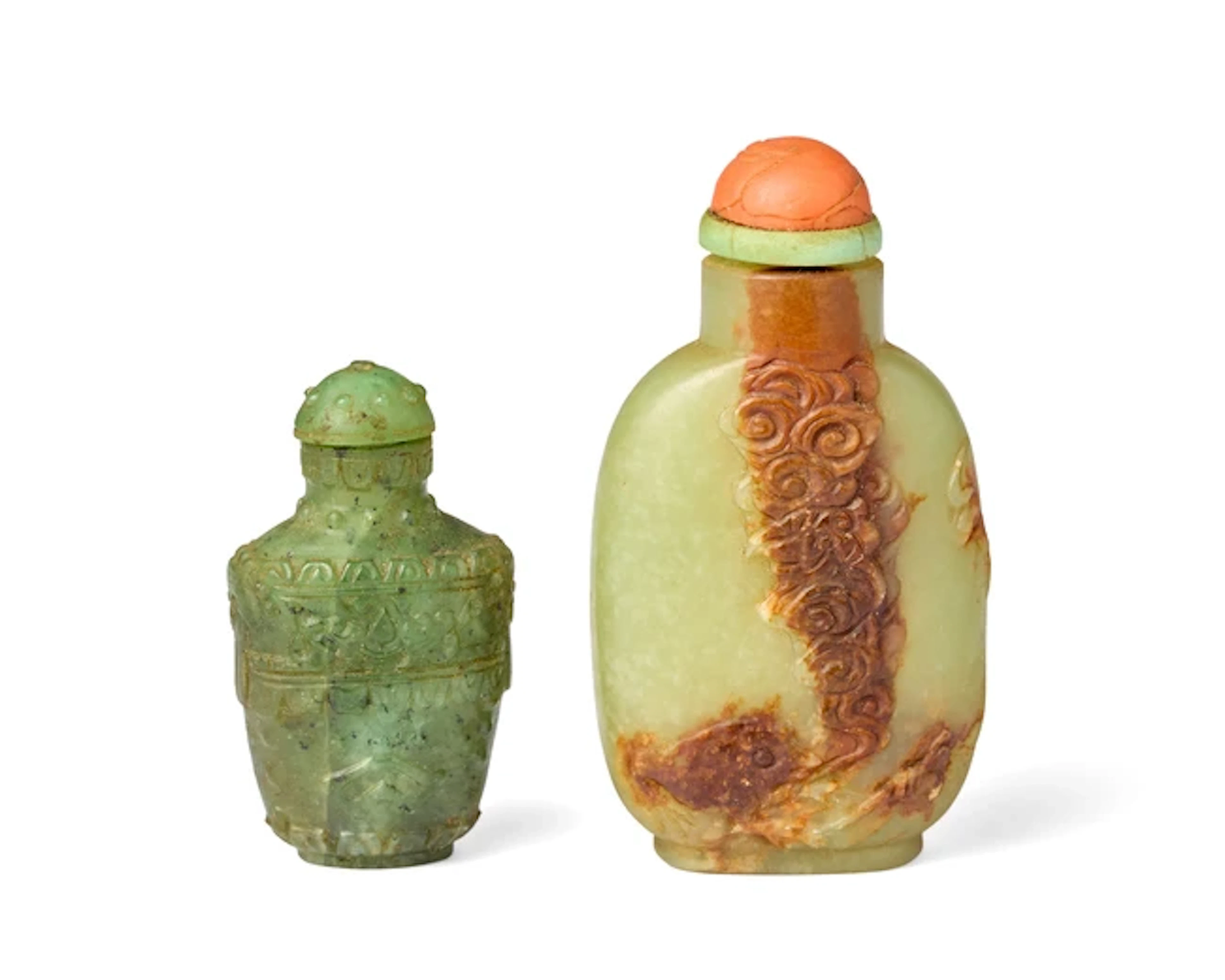A Chinese green and russet jade snuff bottle and a...