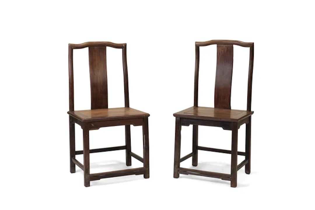 A pair of Chinese hardwood yoke back chairs 20th century Each with square backs