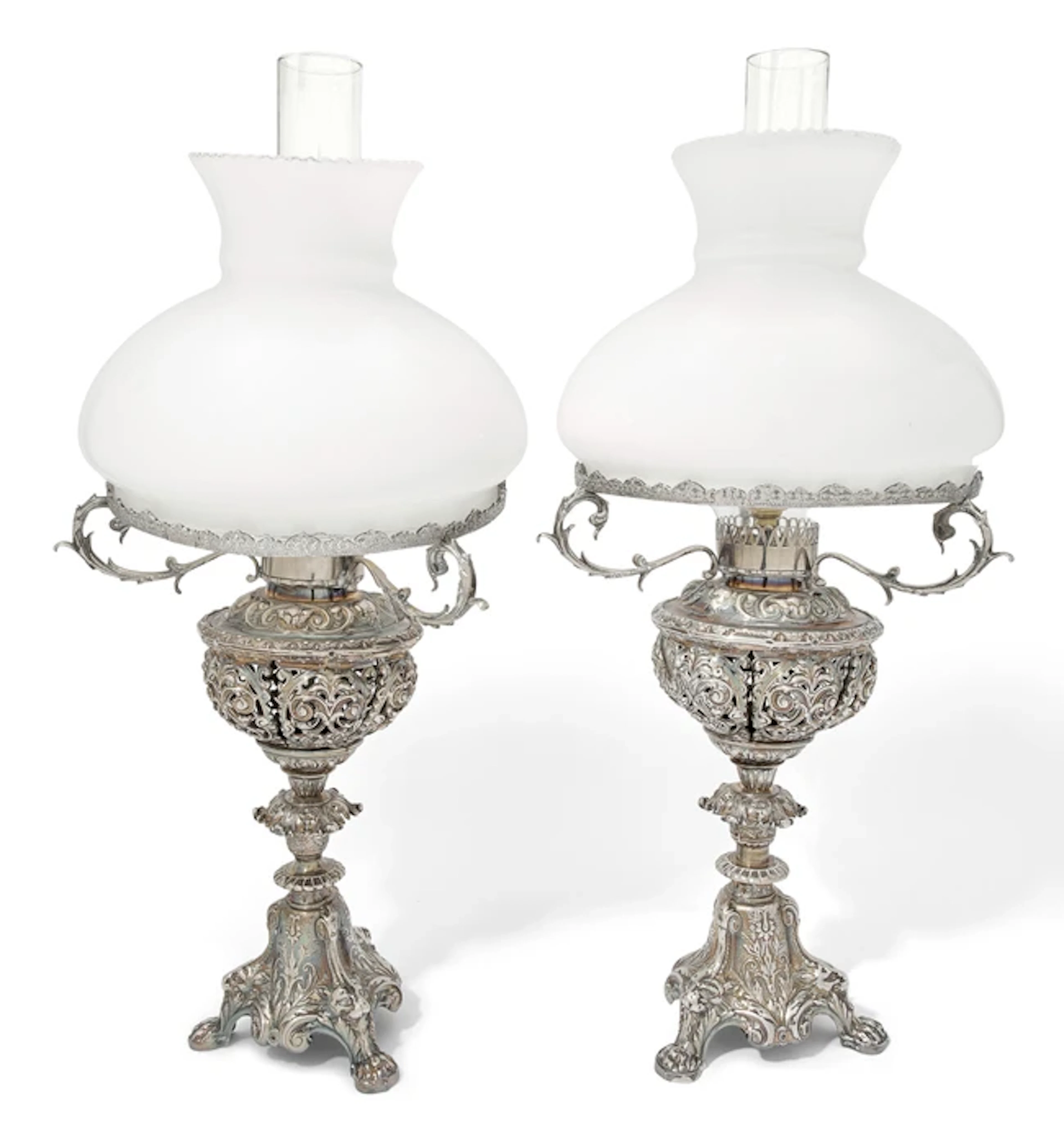 A pair of silver-plated lamps