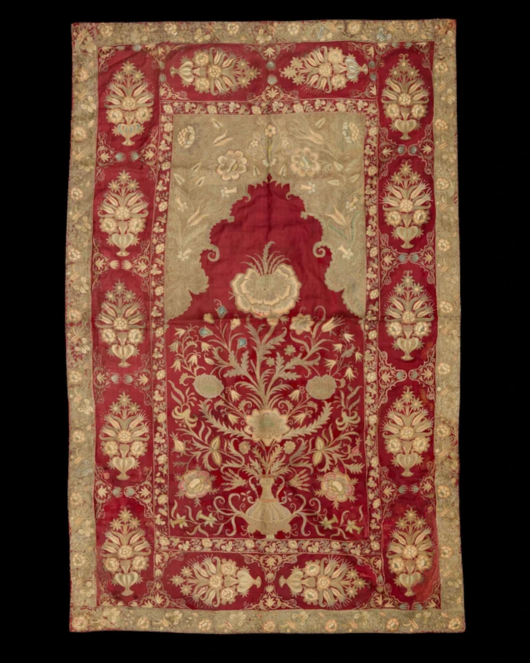 An embroidered silk prayer arched niche (mihrab) panel