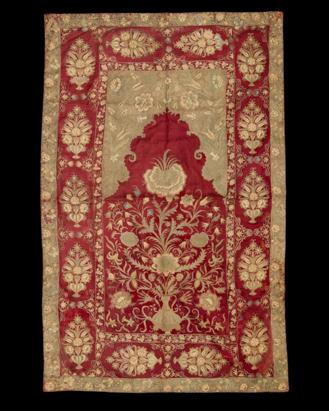An embroidered silk prayer arched niche (mihrab) panel