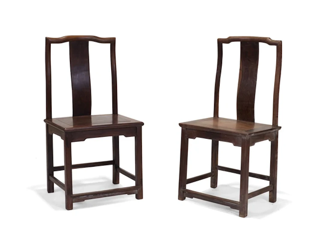 A pair of Chinese hardwood yoke back chairs 20th century Each with square backs