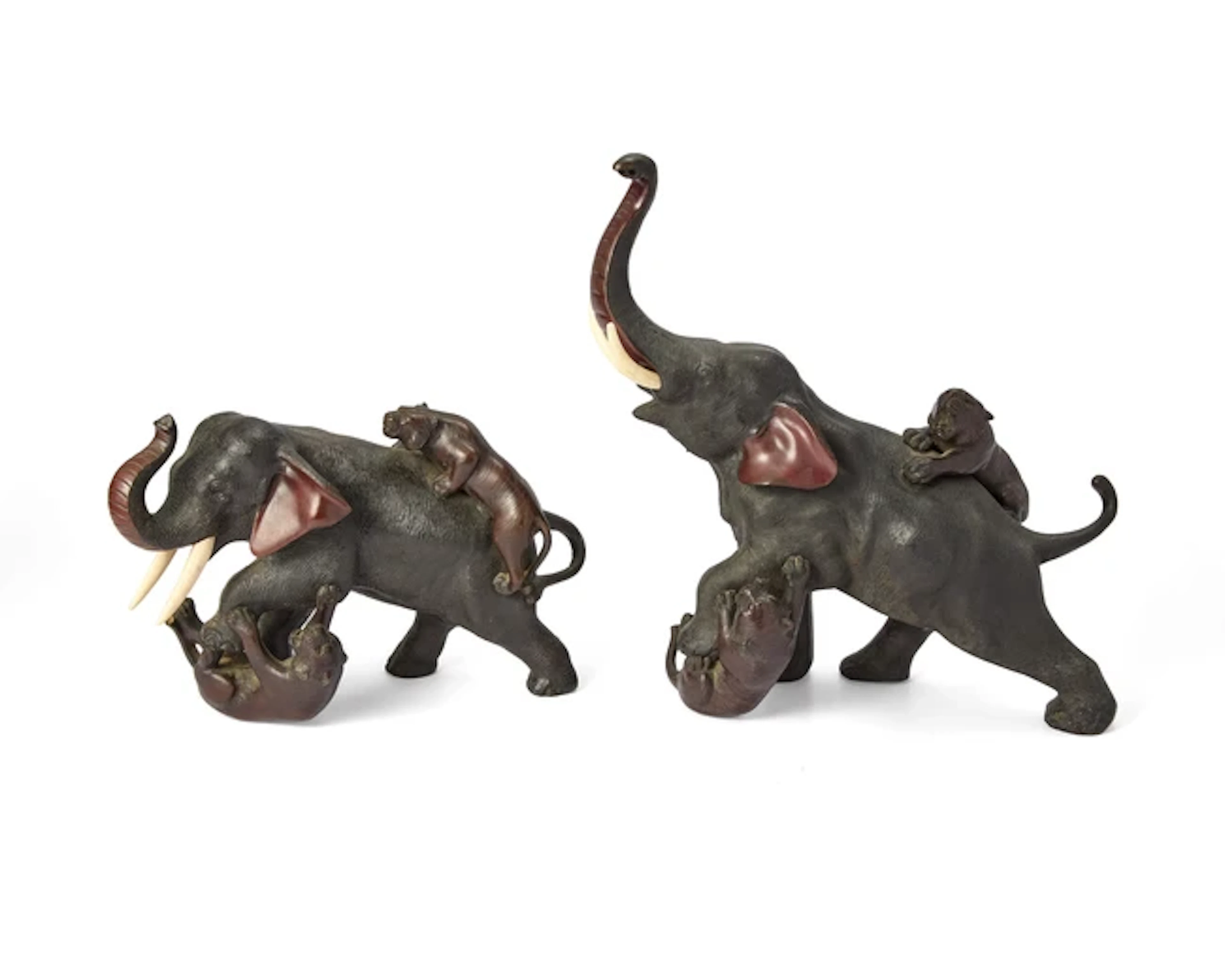 Two Japanese bronze okimono depicting tigers attacking an...