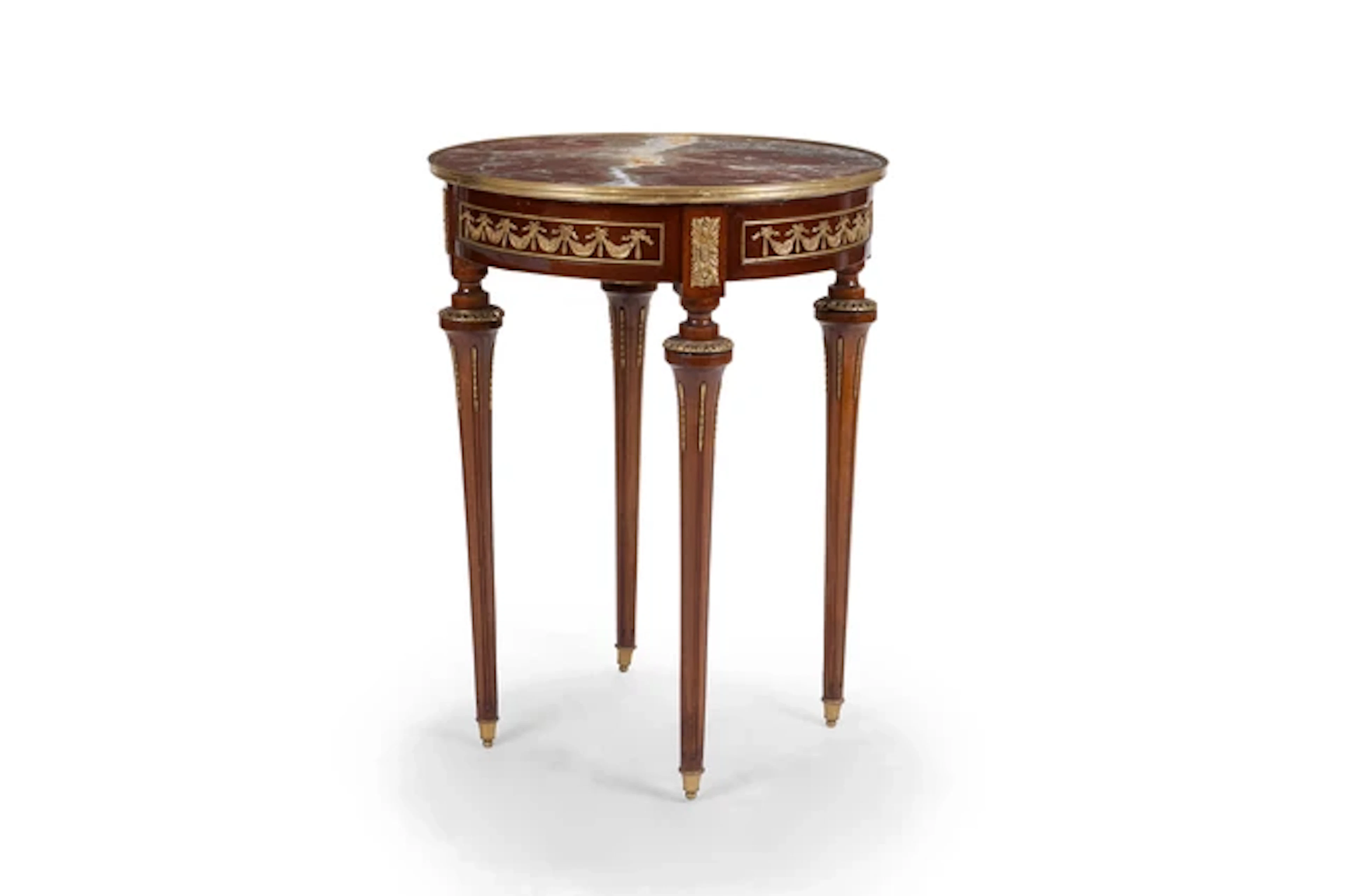 A French gilt-brass mounted stained beech gueridon
