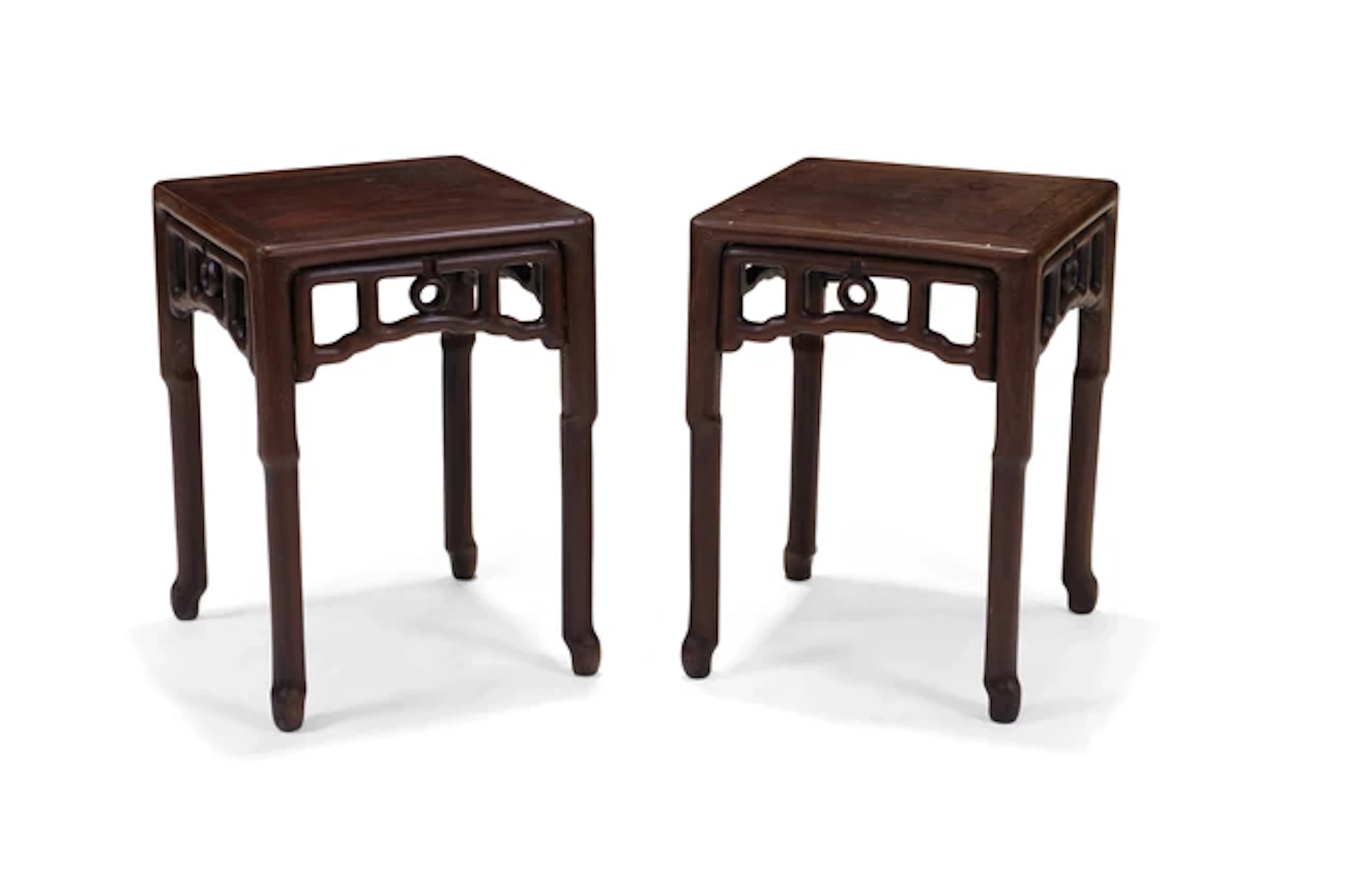 A pair of Chinese hardwood stools 20th century Standing...