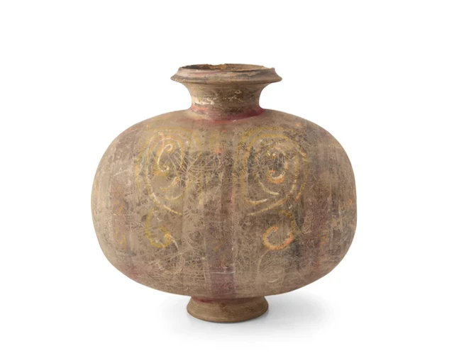 A Chinese painted pottery 'cocoon' jar Han dynasty The...