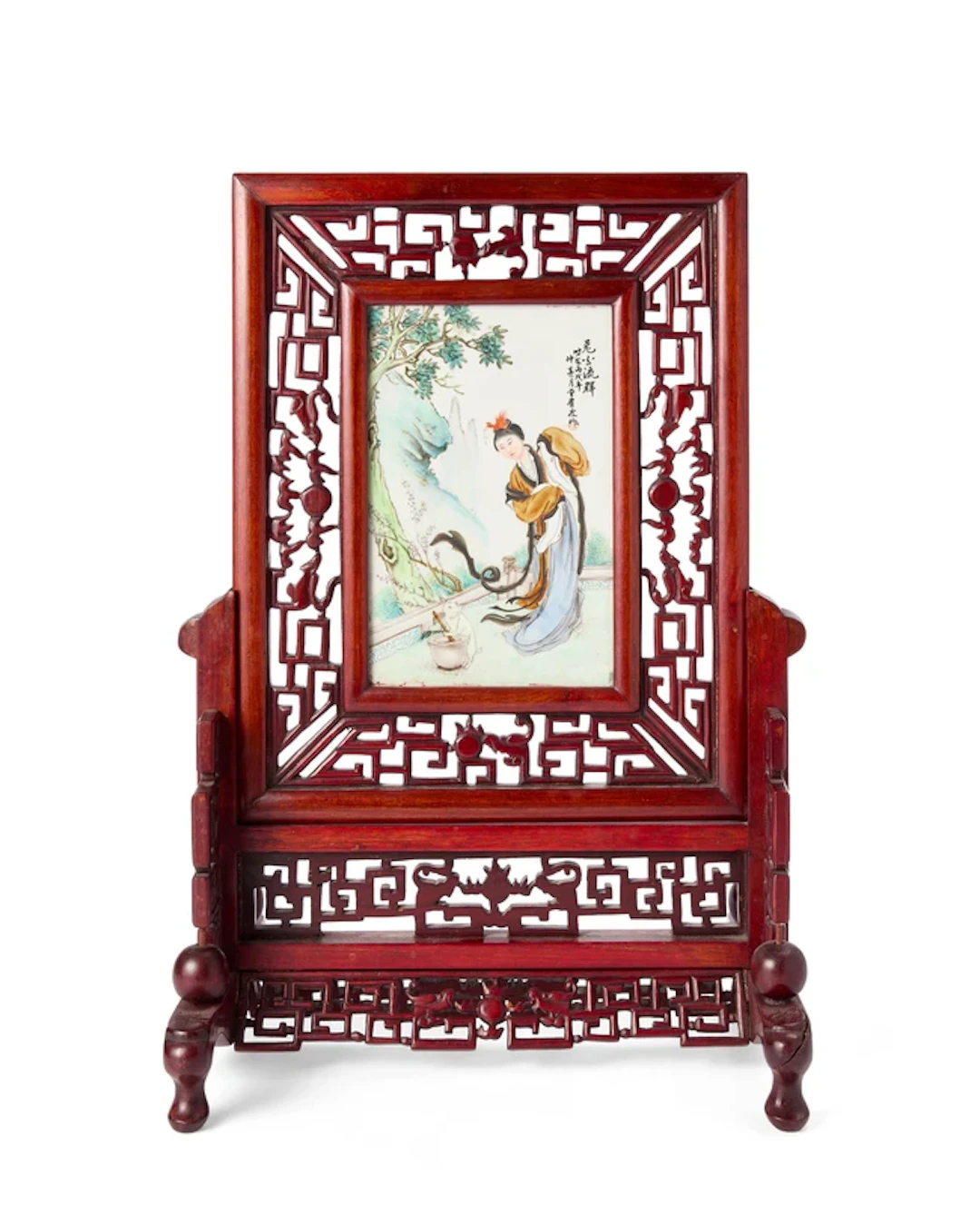 A Chinese table screen inset with famille rose enamelled...