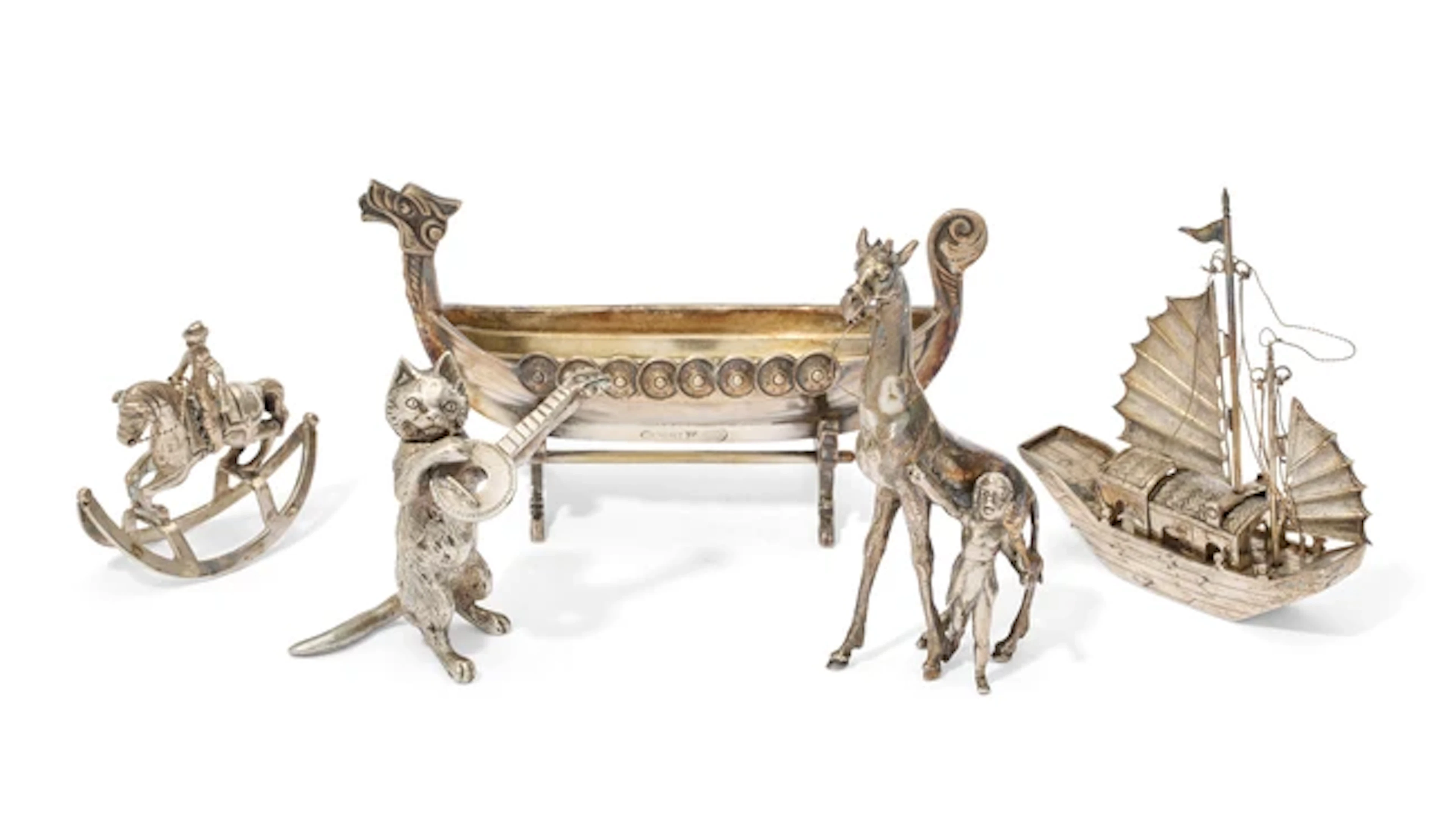 A small group of silver and silver-plated figurines